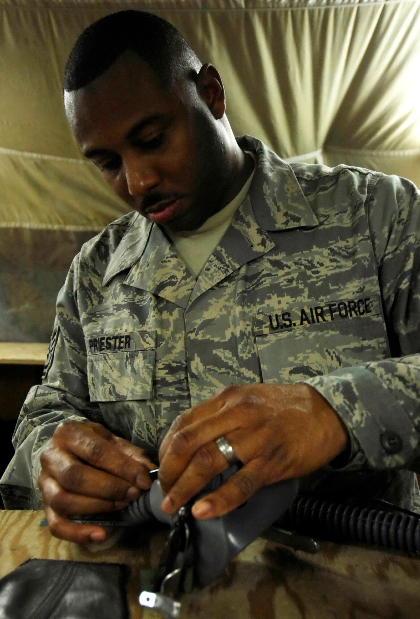 Tech. Sgt. Will Priester performs a routine check on the equipment used by aircrew members Dec. 12 at Bagram Air Base, Afghanistan. Sergeant Priester is an 774th Expeditionary Airlift Squadron aircrew life support technician.  (U.S. Air Force photo/Staff Sgt. Joshua T. Jasper) 
