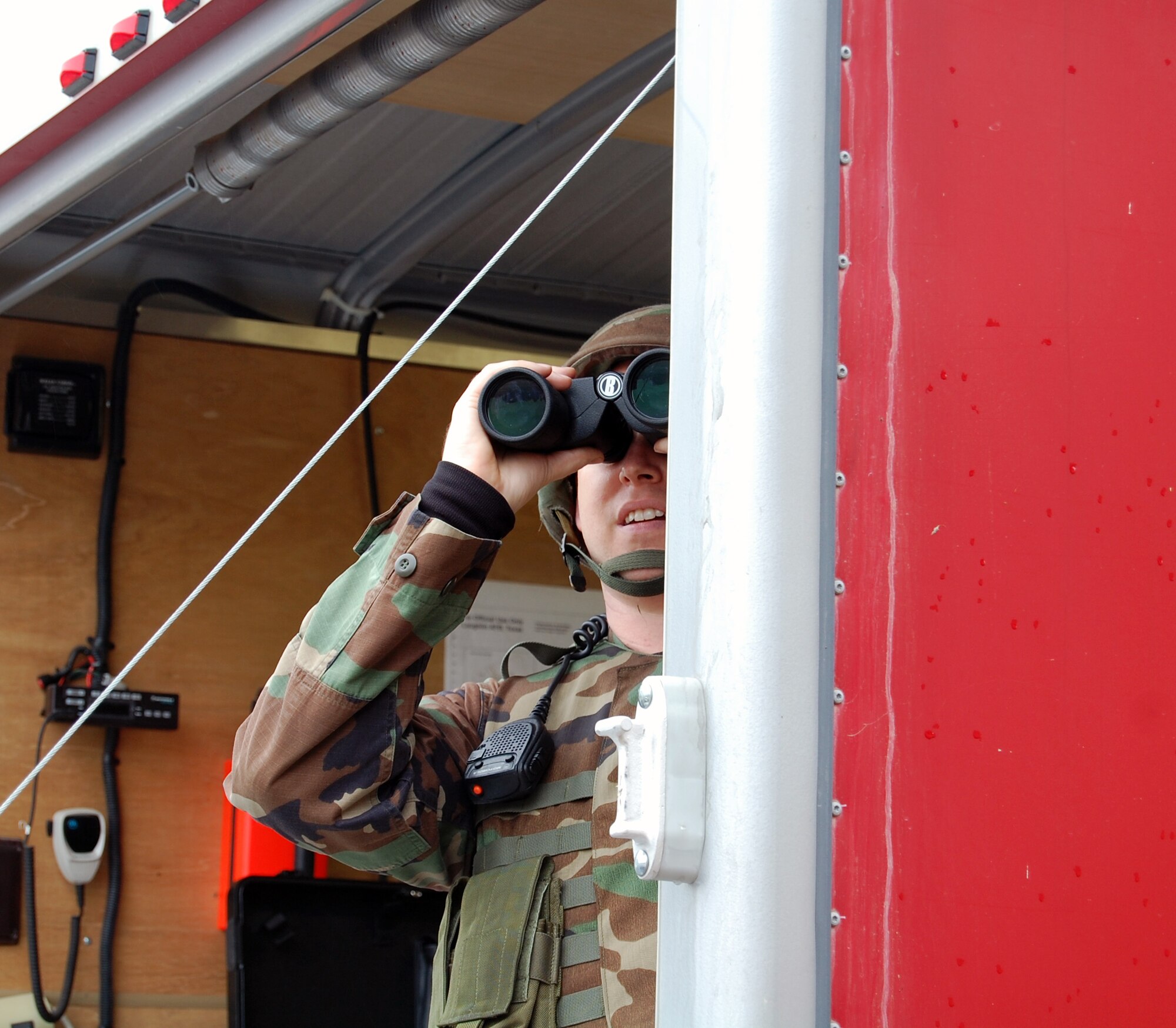 LAUGHLIN AIR FORCE BASE, Texas – An Airman watches for suspicious activity during a hostage situation Dec. 11. Laughlin members work along side Border Patrol and Federal Bureau of Investigation agents to learn how they operate under different situations. Laughlin conducts base-wide exercises often in order to prepare members for incidents and other contingency operations. (U.S. Air Force photo by Airman 1st Class Sara Csurilla)