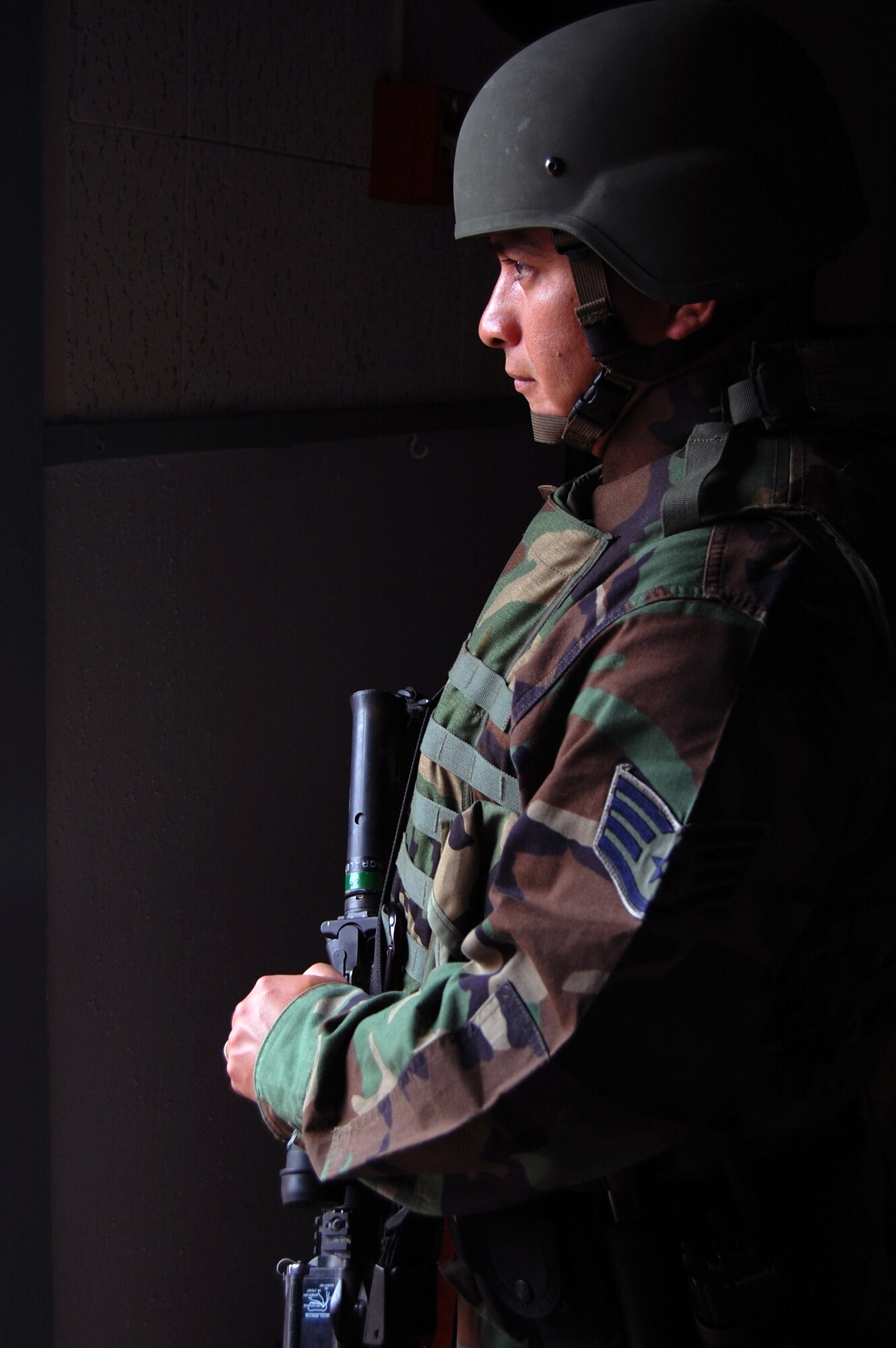 LAUGHLIN AIR FORCE BASE, Texas – Staff Sgt. Eric Morales, 47th Security Forces Squadron, stands guard in Laughlin’s mobile command section during a base exercise Dec. 11. Laughlin members work along side Border Patrol and Federal Bureau of Investigation agents to learn how they operate under different situations. Laughlin conducts base-wide exercises often in order to prepare members for incidents and other contingency operations. (U.S. Air Force photo by Airman 1st Class Sara Csurilla)