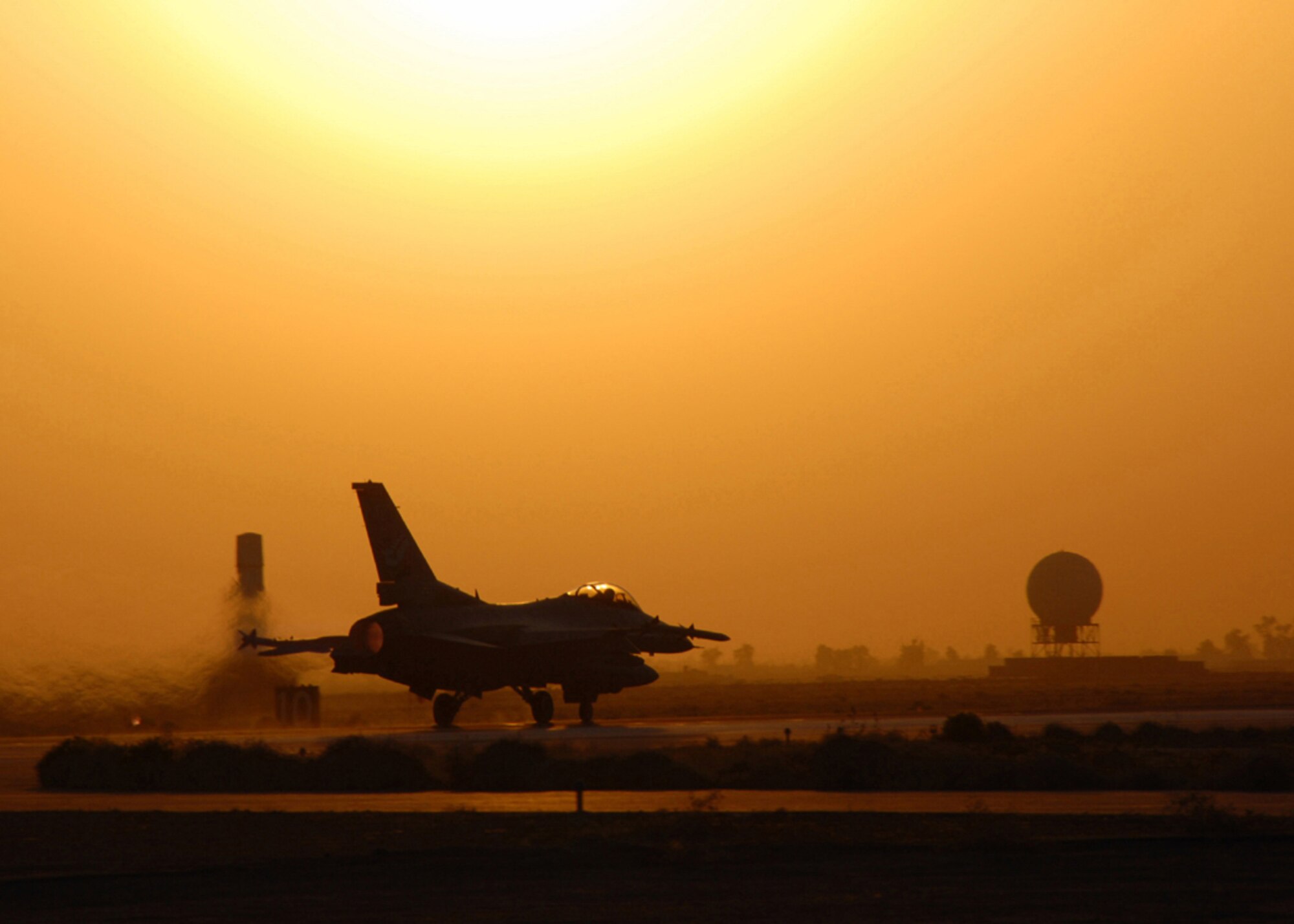 An Air Force F-16 Fighting Falcon takes off from Balad Air Base, Iraq, for a combat mission.  F-16s fly missions in support of Operation Iraqi Freedom.  (U.S. Air Force photo/Tech. Sgt. Beth Holliker)