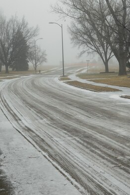 Snow-covered roads make traveling hazardous on Ellsworth after a recent snow storm. Ellsworth road conditions change many times during the winter months, and staying abreast of the most up-to-date traveling conditions may help keep Airmen and their families safe this winter. For current road conditions call 385-ROAD. (U.S. Air Force photo / Airman 1st Class Joshua Seybert)

