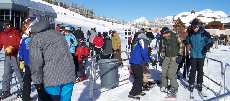 2nd Lt. Dan Jimenez, 741st Missile Security Forces Squadron, and 1st Lt. Alex Courtney, 341st Operations Support Squadron, get their lift tickets scanned as they prepare to head up the slopes at the Big Sky resort. Big Sky held a Military Appreciation weekend Dec. 7 to 9. (U.S. Air Force photo/Airman 1st Class Emerald Ralston)