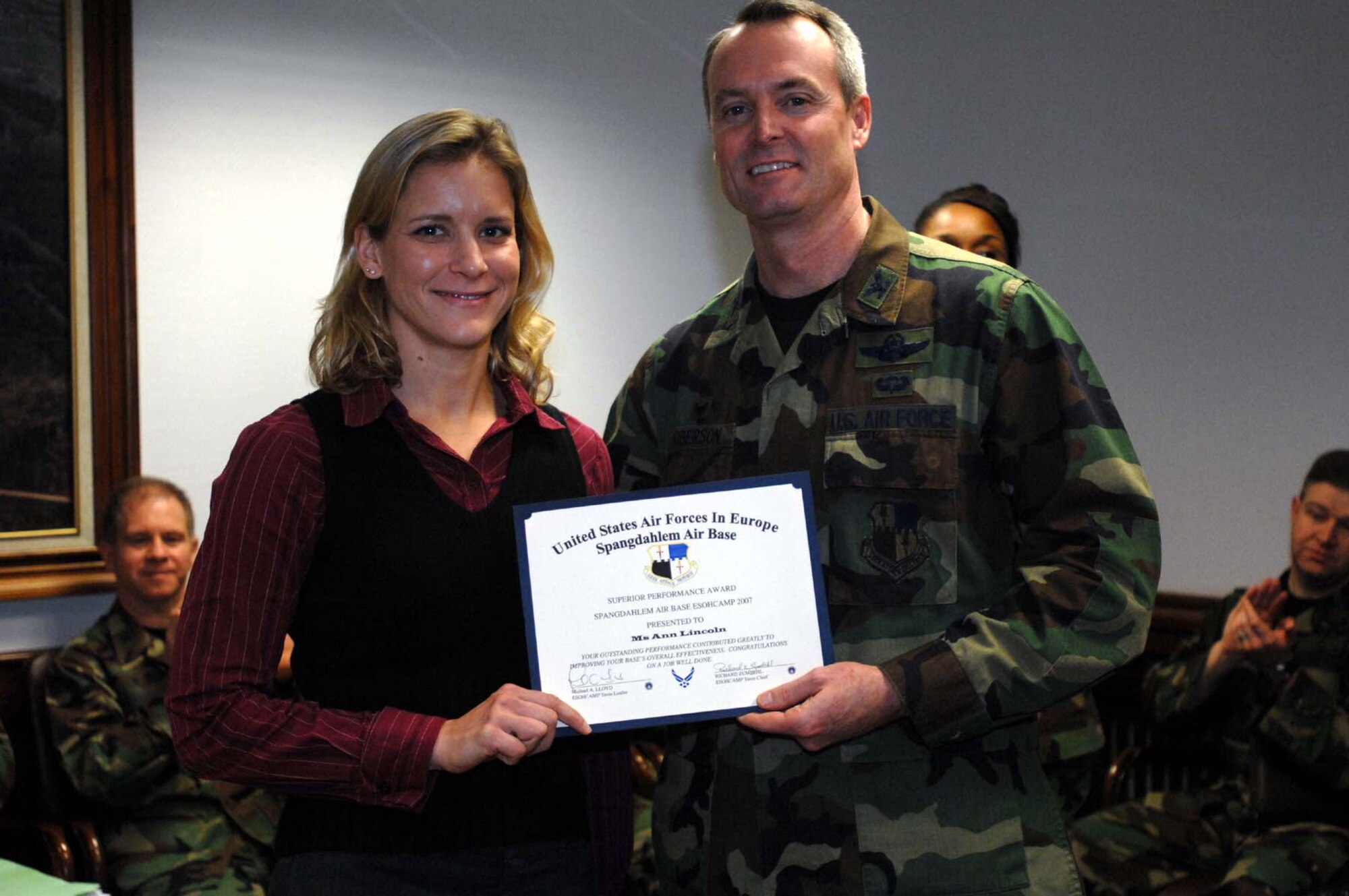 SPANGDAHLEM AIR BASE, Germany -- Ann Lincoln, 52nd Civil Engineer Squadron,  is recognized by Col. Darryl Roberson, 52nd Fighter Wing commander, for superior performance during an Environmental, Safety, Occupational Health, Compliance Assessment and Management Program Assessment Dec. 12, 2007. (U.S. Air Force photo/Airman 1st Class Jenifer Calhoun)