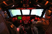 MINOT AIR FORCE BASE, N.D. -- 1st Lt. David Davis (left) and 1st Lt. Jason Mahaffey (right), both 23rd Bomb Squadron B-52 pilots, practice flying over Andersen Air Force Base, Guam, as part of their proficiency training in the Weapon System Trainer here. (U.S. Air Force photo by Maj. Laurie Arellano)