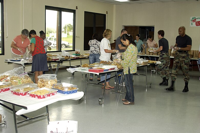 Team Andersen servicemembers, civilians and spouses all volunteered to provide cookies for Andersen Airmen during the Cookie Caper event held in the Chapel 2 annex Dec. 18. (U.S. Air Force photo/Airman 1st Class Carissa Morgan)