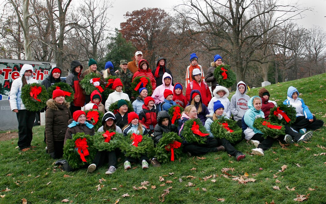 Sixth graders from Calient, Nev., pose for a class picture during an annual holiday event to honor and remember veterans at Arlington National Cemetery, Dec. 15, 2007. The students came as volunteers to help place more than 10,000 wreaths on graves.