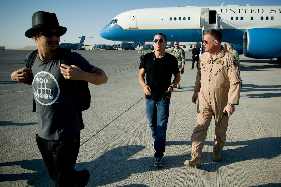 Award-winning musician Kid Rock and Tour de France champion Lance Armstrong arrive at Qatar, for the USO Holiday Tour, Dec. 17, 2007. Along with Kid Rock and Armstrong, Chairman of the Joint Chiefs of Staff and host of the tour Navy Adm. Mike Mullen was joined by comedians Lewis Black and Robin Williams, and Miss USA Rachel Smith in the 15-stop, seven-country tour thanking forward deployed troops for their sacrifice and service. 