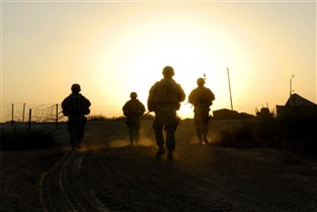 Soldiers return to Camp Taji, Iraq, Dec. 17, 2007, after a patrol.