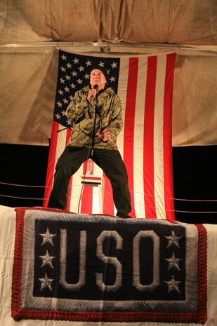 AL TAQADDUM, Iraq (Dec. 18, 2007) ? Comedian Robin Williams entertains U.S. troops as part of a United Service Organization tour here Dec. 18.  Williams, along with Lewis Black, Miss USA Rachel Smith, Kid Rock and Lance Armstrong, came to visit troops during the holiday season.  The celebrities will continue their tour throughout the season making additional stops in Iraq and Afghanistan.