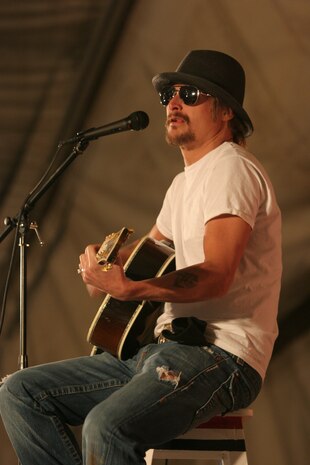 AL TAQADDUM, Iraq (Dec. 18, 2007) ? Musician Kid Rock performs for U.S. troops as part of a United Service Organization tour here Dec. 18.  Rock, along with Lance Armstrong, Lewis Black, Robin Williams, Miss USA Rachel Smith, Kid Rock and Lance Armstrong, came to visit troops during the holiday season.  The celebrities will continue their tour throughout the season making additional stops in Iraq and Afghanistan.