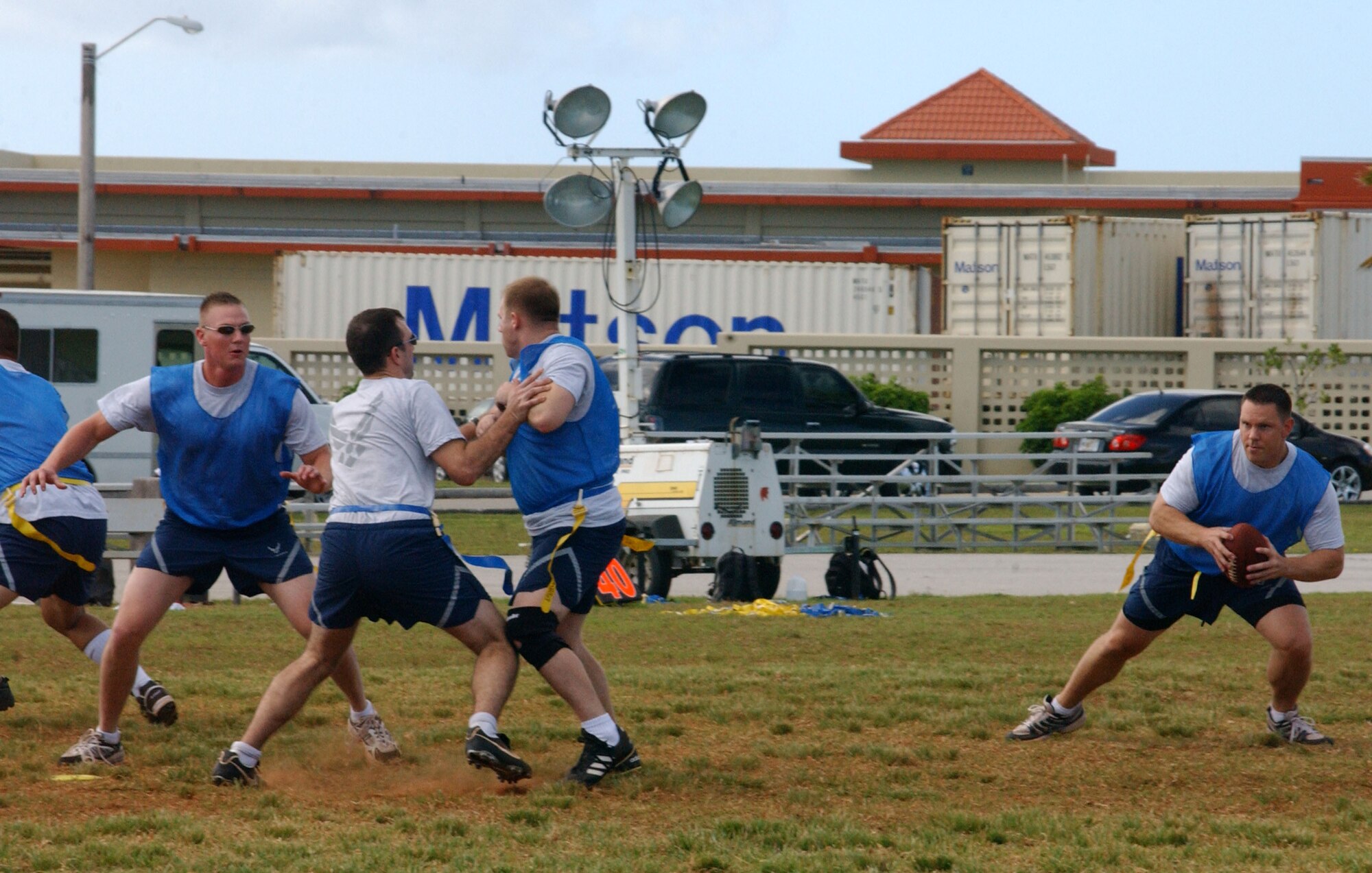 Tiger quarterback Capt. Bill “Moose” Free, scrambles to his left during the flag football tournament here December 14. The football tournament was part of Andersen’s afternoon of competition in various events. Captain Free and his Tigers eventually took first place in the large unit category for football in the Team Andersen Challenge. (Air Force photo/Tech. Sgt. Steven Wilson) 