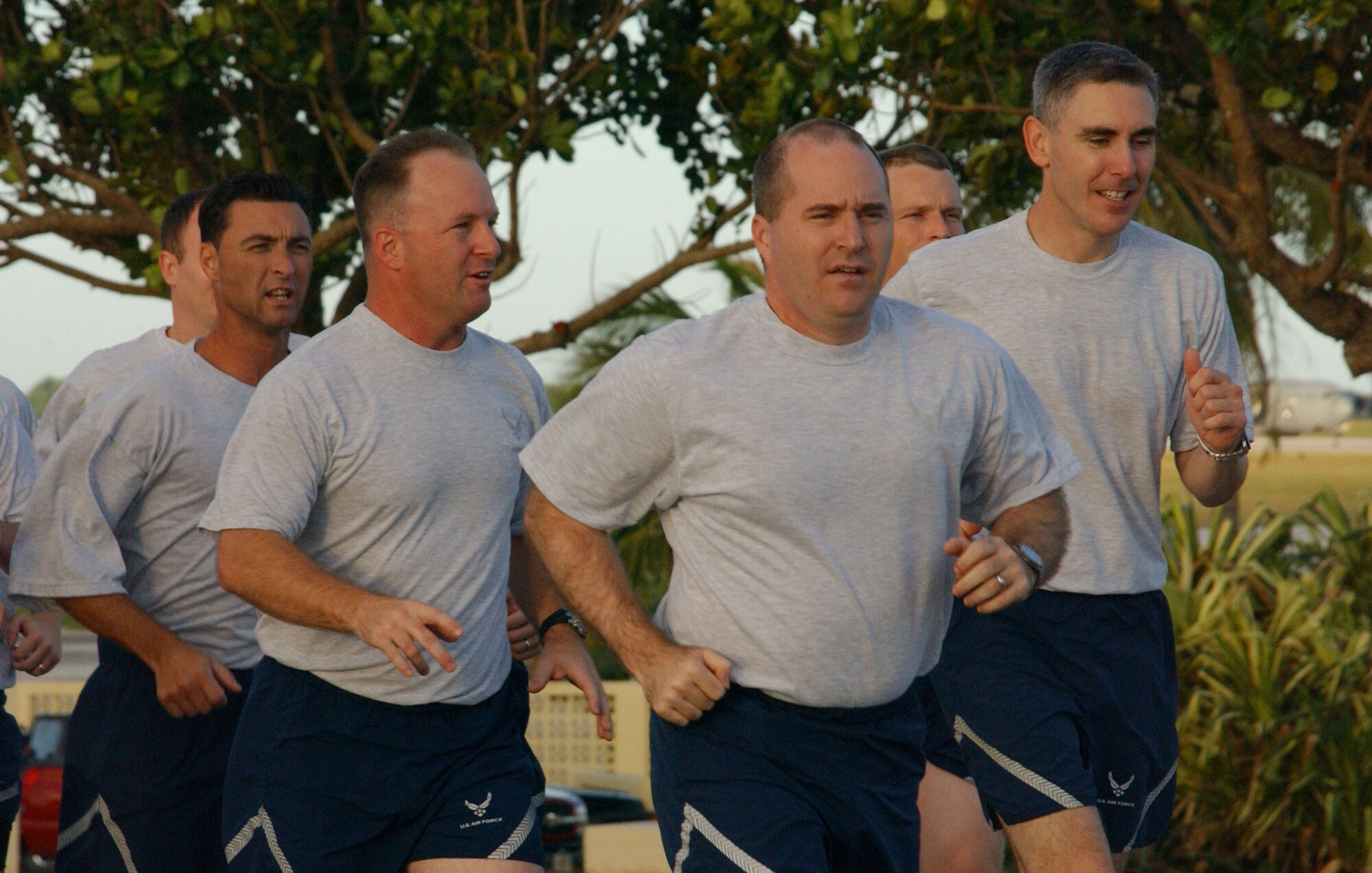 Col. Damian McCarthy, 36th Operations Group commander (center) and Lt. Col. John Vitacca, 393rd Expeditionary Bomb Squadron commander (right) lead the operations group flight on the wing run that kicked off the annual team Andersen challenge. After the run, all Airmen went back to their respective organizations and participated in various seminars aimed at health and wellness. Then, the 36th Wing began its afternoon of competitions in various events throughout the installation. (Air Force photo/Tech. Sgt. Steven Wilson) 