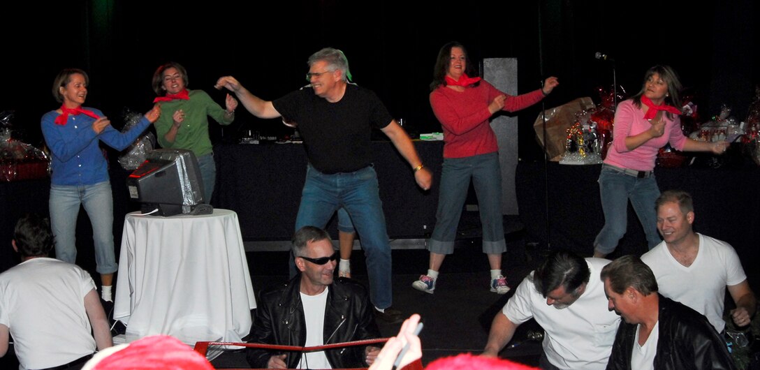 The ARPC directors perform their "Greased Lightning" skit during the "Idol" competition at the holiday party Dec. 14. More than 250 people attended this year's festivities at the Lowry Tavern's Soiled Dove. (U.S. Air Force photo/Ellen Edwards)