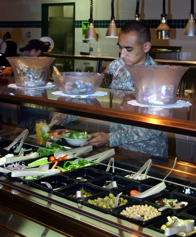 Army Spc. Luis Luna, 264th Detachment, prepares a salad at the Tumbleweed Dining Facility Dec. 14.  Tumbleweed represents one of the dining experiences that earned Sheppard the Air Education and Training Command-level award for best operation, and a shot at competing for the Air Force-wide John L. Hennessy Award. (U.S. Air Force photo/Staff Sgt. Tonnette Thompson)