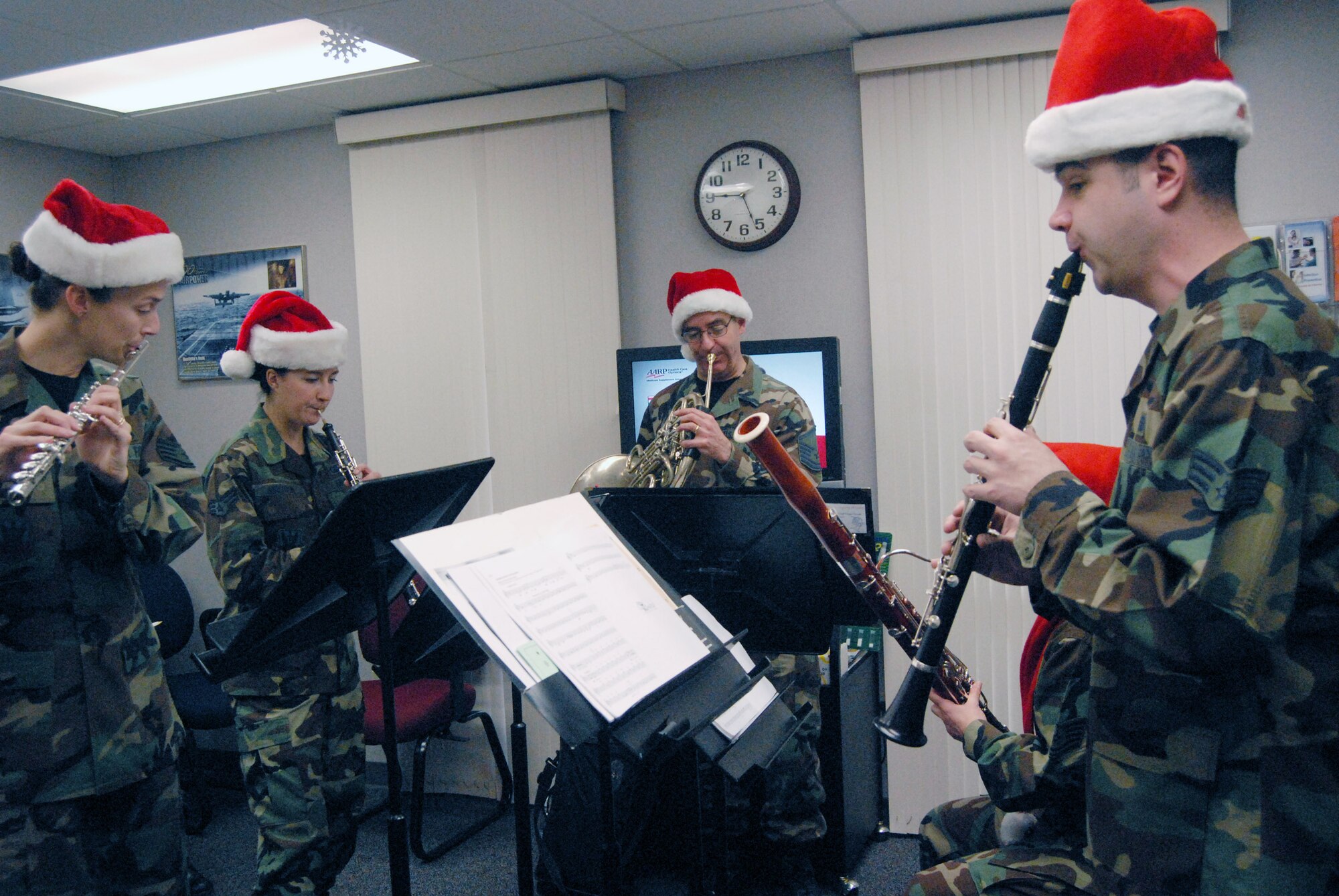 Airmen from the Langley Winds, Heritage of America Band, perform for Airmen Dec.13 at Pope Air Force Base, N.C. The band from Langley AFB, Va., came to the base to bring holiday cheer to the Airmen. (U.S. Air Force photo/Airman Mindy Bloem)