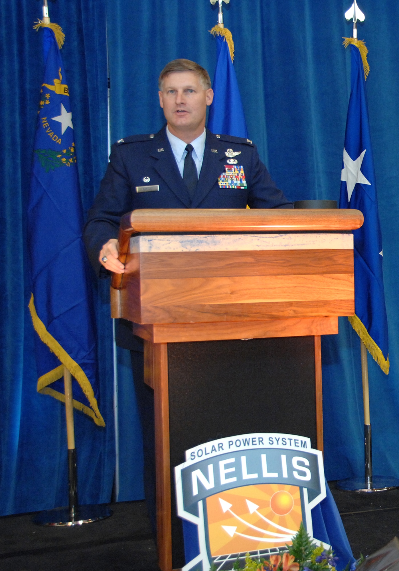 Col. Michael Bartley,99th Air Base Wing commander speaks at the grand opening of North America's largest solar photovoltaic power plant located at Nellis Air Force Base, Nev., Dec. 17, 2007. The Solar Power System will meet an average of 25 percent of Nellis' electricity requirements.
(U.S. Air Force photo by Staff Sgt. Scottie McCord) 