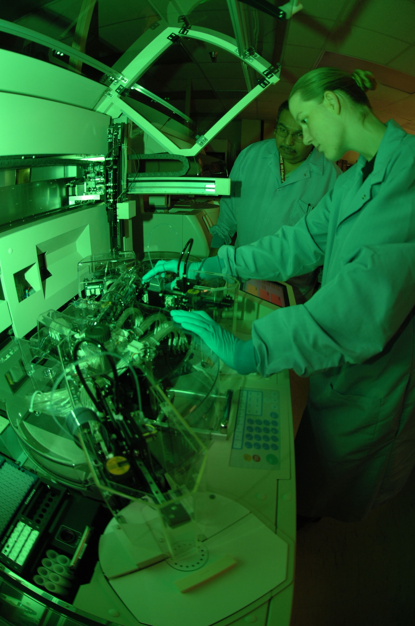 Staff Sgt. Kristin Parsons loads reagents into the ImmunoCap 1000, a newly acquired allergy testing machine in the Diagnostic Immunology laboratory at Wilford Hall Medical Center, Lackland Air Force Base, Texas.  The laboratory recently was named as the Air Force's Center of Excellence for allergen testing.  Sergeant Parsons is an immunology technician in the 59th Laboratory Squadron.  (U.S. Air Force photo/Senior Airman Erin M. Peterson)