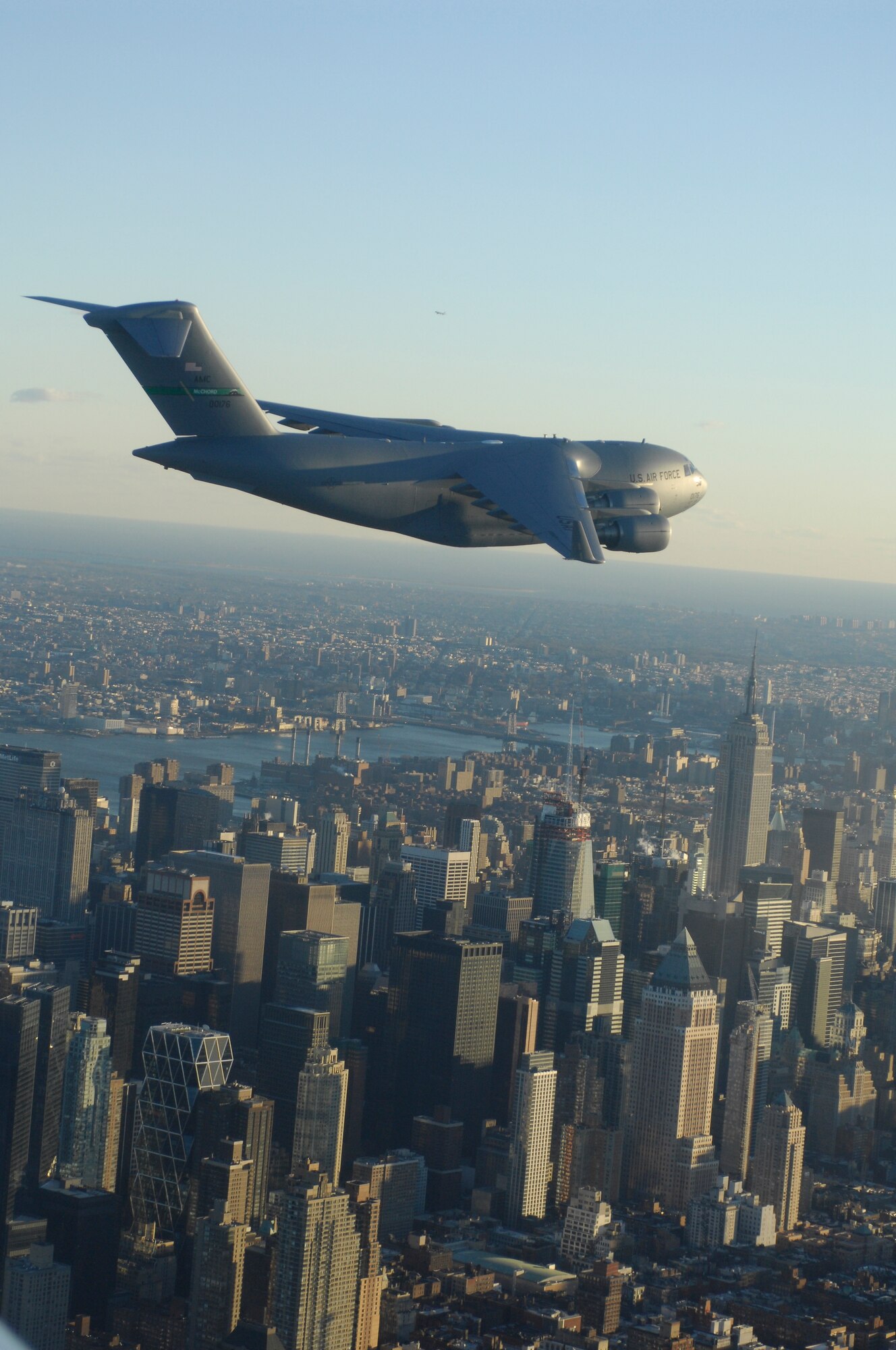 A McChord C-17 Globemaster III flies the skies of New York City Dec. 17. The historic flight is powered by a 50/50 blend of traditional and synthetic fuels.