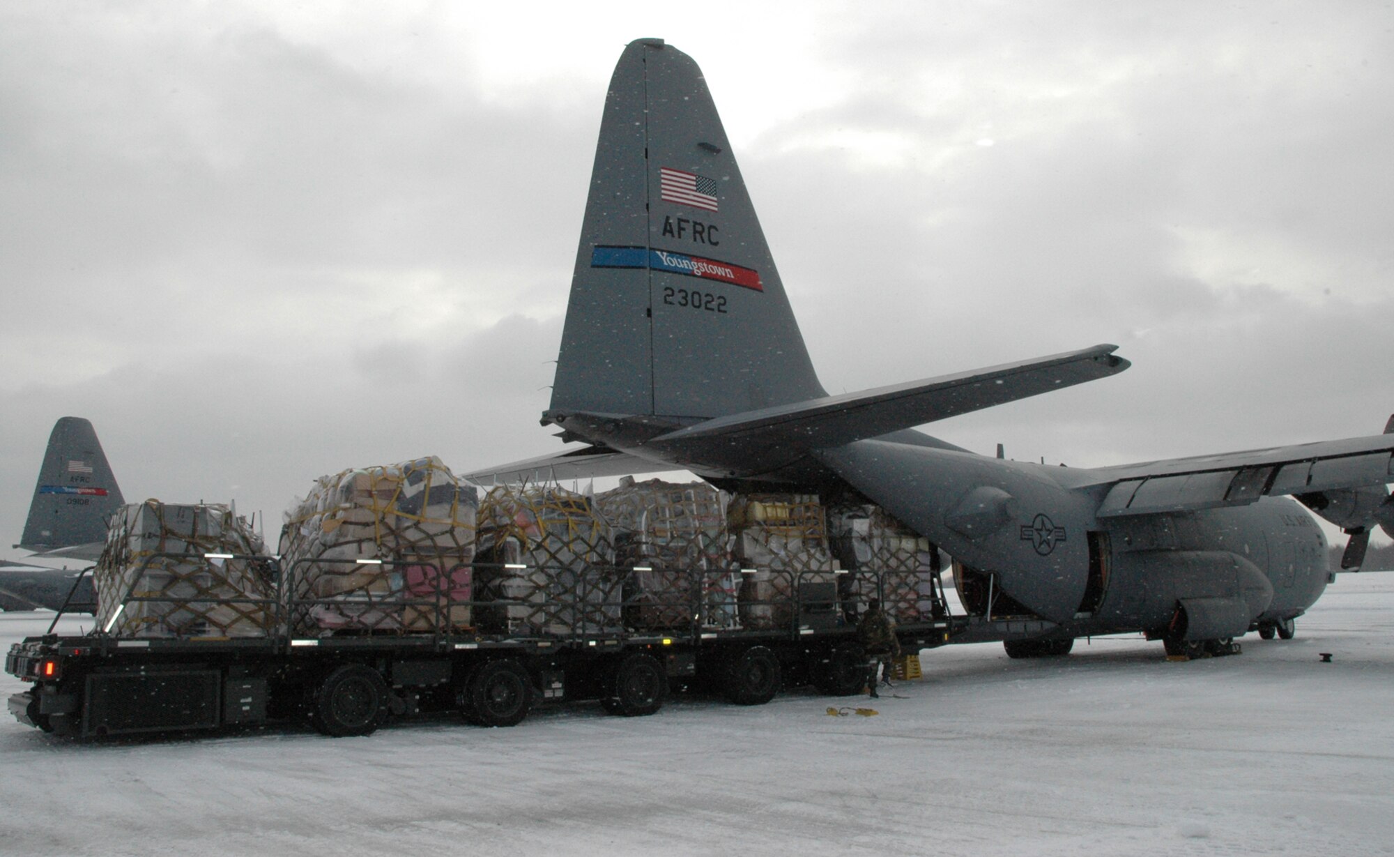 YOUNGSTOWN AIR RESERVE STATION, Ohio — An Air Force Reserve C-130 Hercules from the 910th Airlift Wing here receives a load of gifts from around the Youngstown area just before take-off to the jungles of Honduras December 17.  A joint effort between the 910th Airlift Wing and the non-profit organization "Mission of Love," of Austintown, Ohio, made this trip possible during this Christmas and holiday season.  Approximately 18,000 pounds of supplies including food, beds, toys, and school supplies provided by the local Mahoning Valley community will make a big difference in the lives of an indigenous Indian tribe in Honduras.  According to Kathleen Price, founder and director of the Mission of Love, the tribe lives in huts, bathes in streams and lacks the most basic educational tools such as pencils and paper.  This mission will be the first of several to Honduras in an effort to supply a hospital and a school.  The Air Force Reserve mission was made possible under provisions of the Denton Program which allows private U.S. citizens and organizations to use space available on U.S. military cargo planes to transport humanitarian goods to countries in need.  For more information about the Mission of Love Foundation, please visit www.missionoflove.org or for more information about the Denton Program, go to www.usaid.gov.  U.S. Air Force Photo/Capt. Brent J. Davis