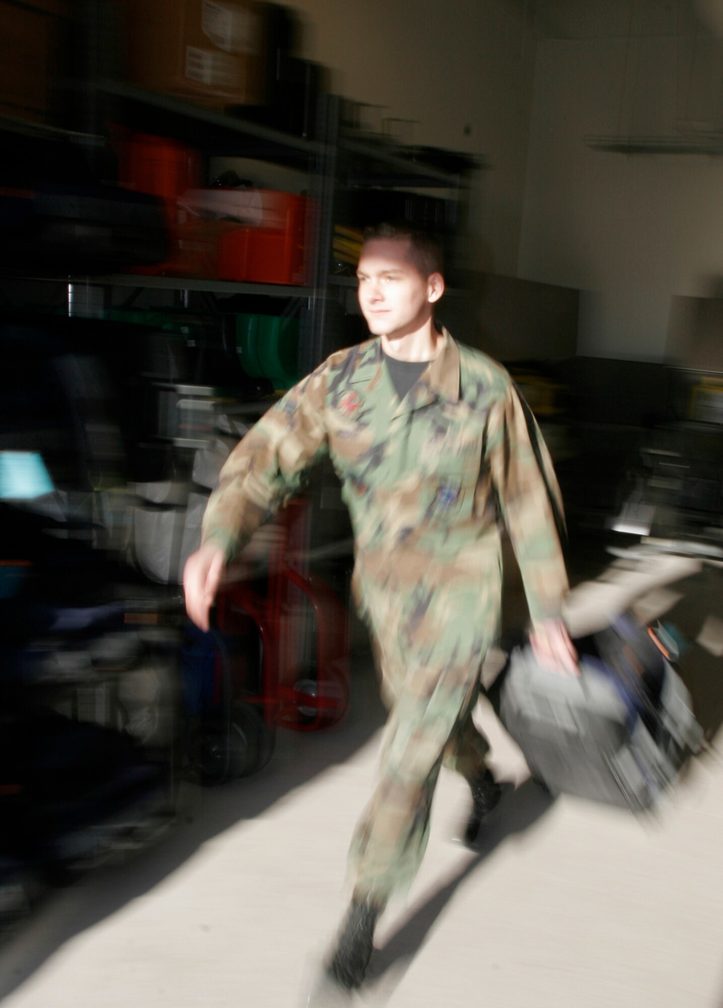 Airman 1st Class Justin Murphy, bioenvironmental engineer technician, demonstrates emergency response procedures conducted from the new bioenvironmental building readiness room, Dec. 14. The newer, larger facility provides centralized command and control for response teams, allowing technicians to respond quicker to emergencies. (U.S. Air Force photo by Staff Sgt. Jacob R. McCarthy)