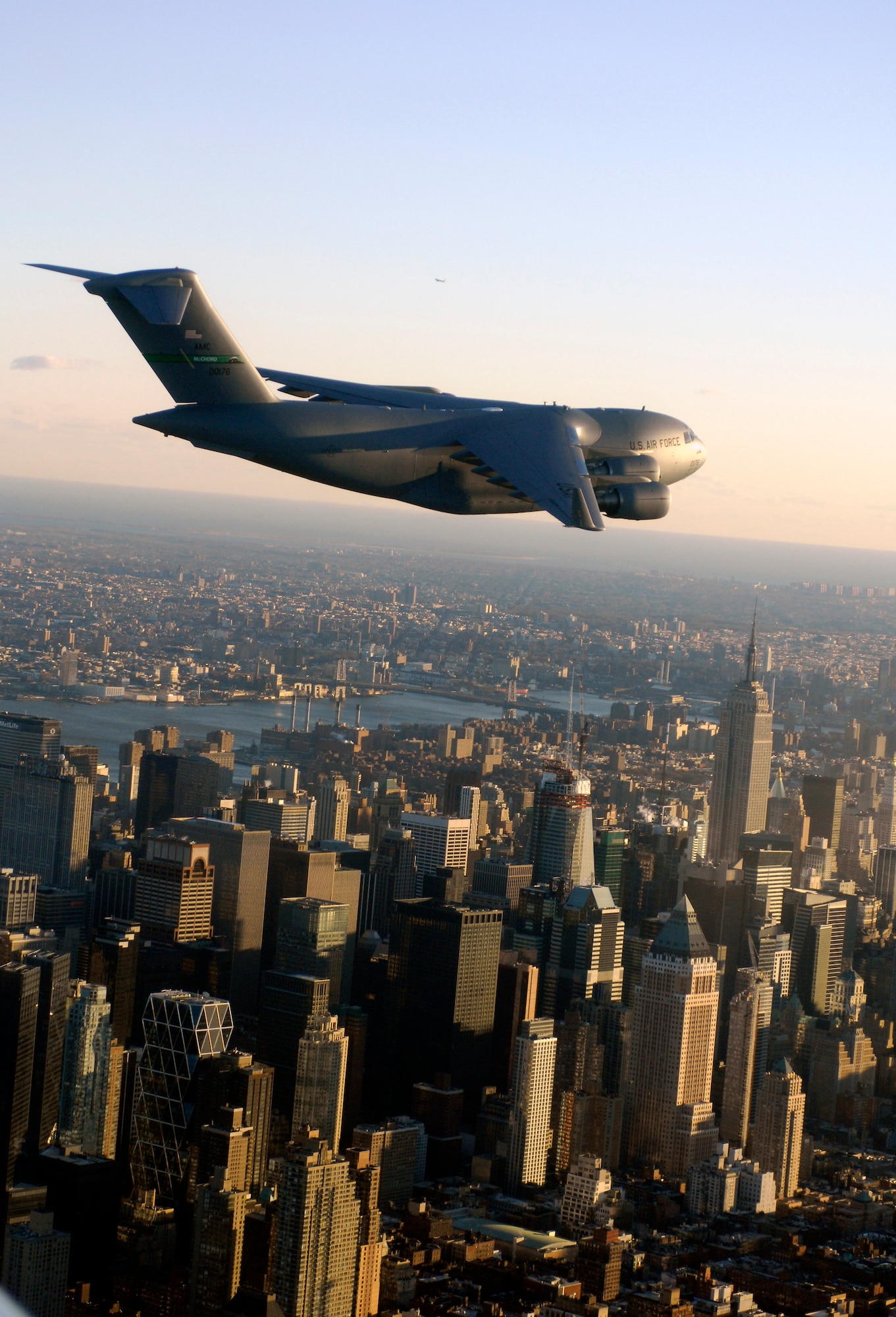 A C-17 Globemaster III flies over New York City after completing the first transcontinental flight on synthetic fuel Dec. 17. The C-17 took off before dawn from McChord Air Force Base, Wash., and landed in the early afternoon at McGuire AFB, N.J. (U.S. Air Force)