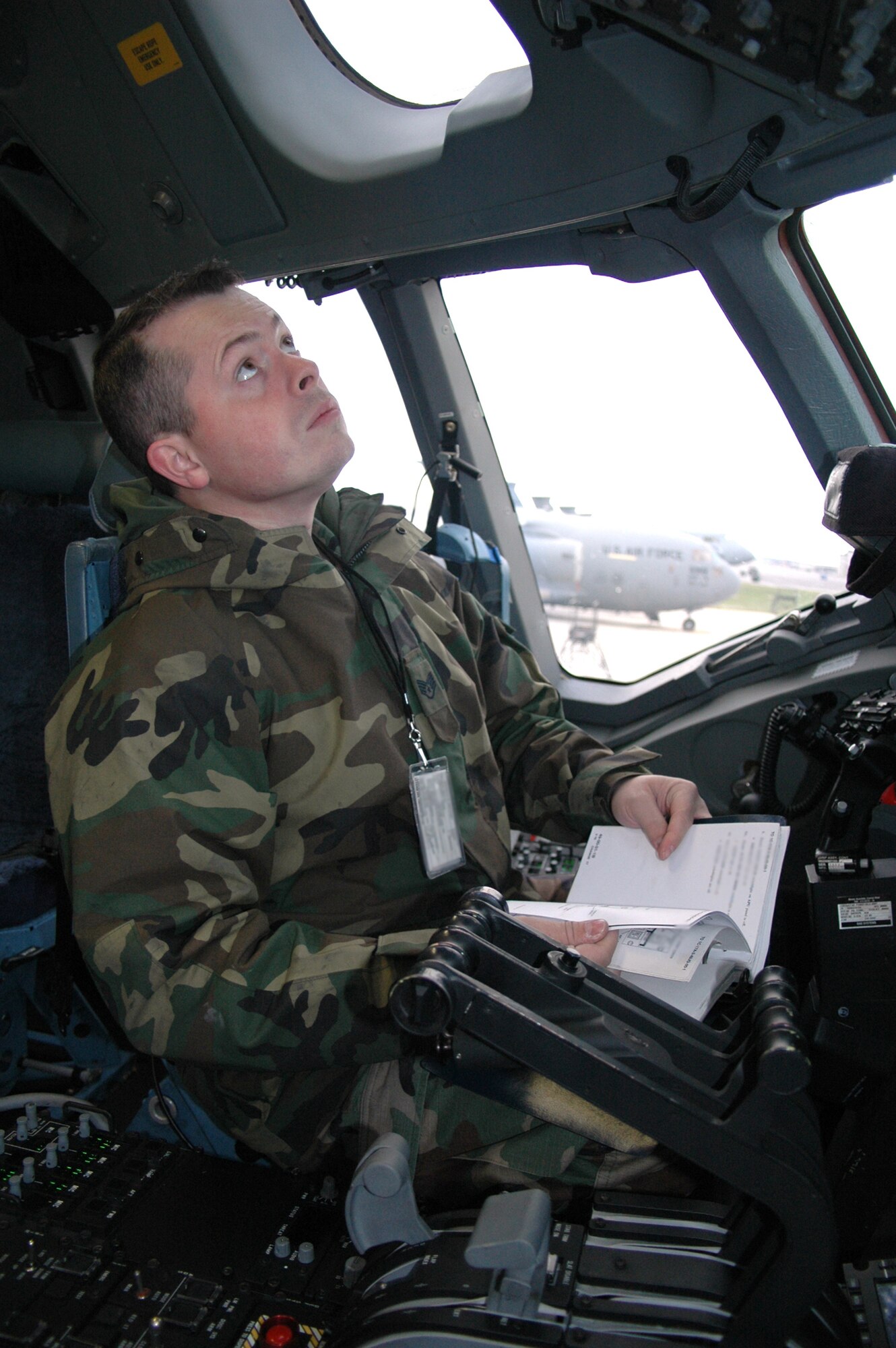 DOVER AIR FORCE BASE, Del. -- Staff Sgt. Jesse Marquardt, of the Air Force Reserve's 712th Aircraft Maintenence Squadron here, provides auxillary power to the C-17 Globemaster III during a routine maintenance inspection. The 712th AMXS is the 512th Airlift Wing's newest squadron. For the past year, the 712th Aircraft Maintenance Squadron has worked side-by-side active duty's newly-formed 736th AMXS to perform all the flightline maintenance for Dover's seven C-17s. (Air Force photo/Senior Airman Andria J. Allmond)