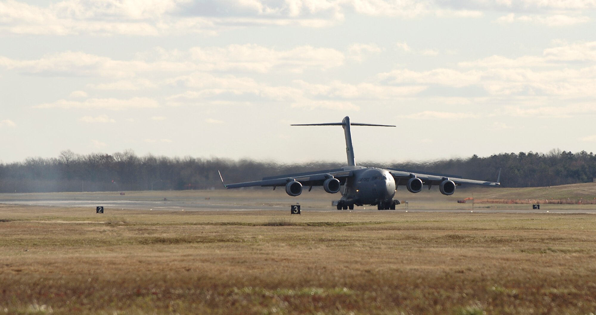 A USAF C-17 Globemaster III lands at McGuire Air Force Base, NJ after completing the first transcontinental flight on synthetic fuel.  (U.S. Air Force photo/Kenn Mann)