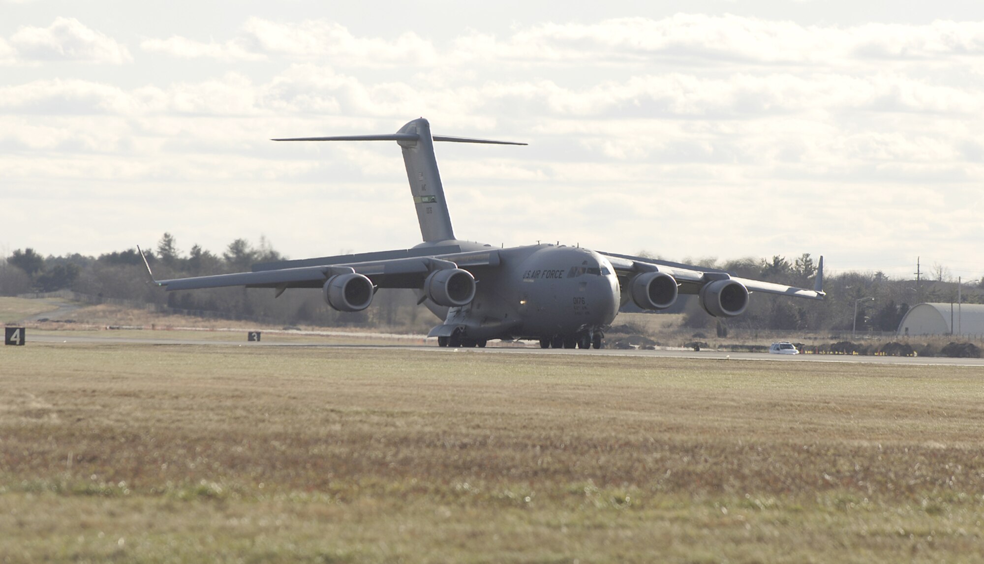 A USAF C-17 Globemaster III lands at McGuire Air Force Base, NJ after completing the first transcontinental flight on synthetic fuel. (U.S. Air Force photo/Kenn Mann)