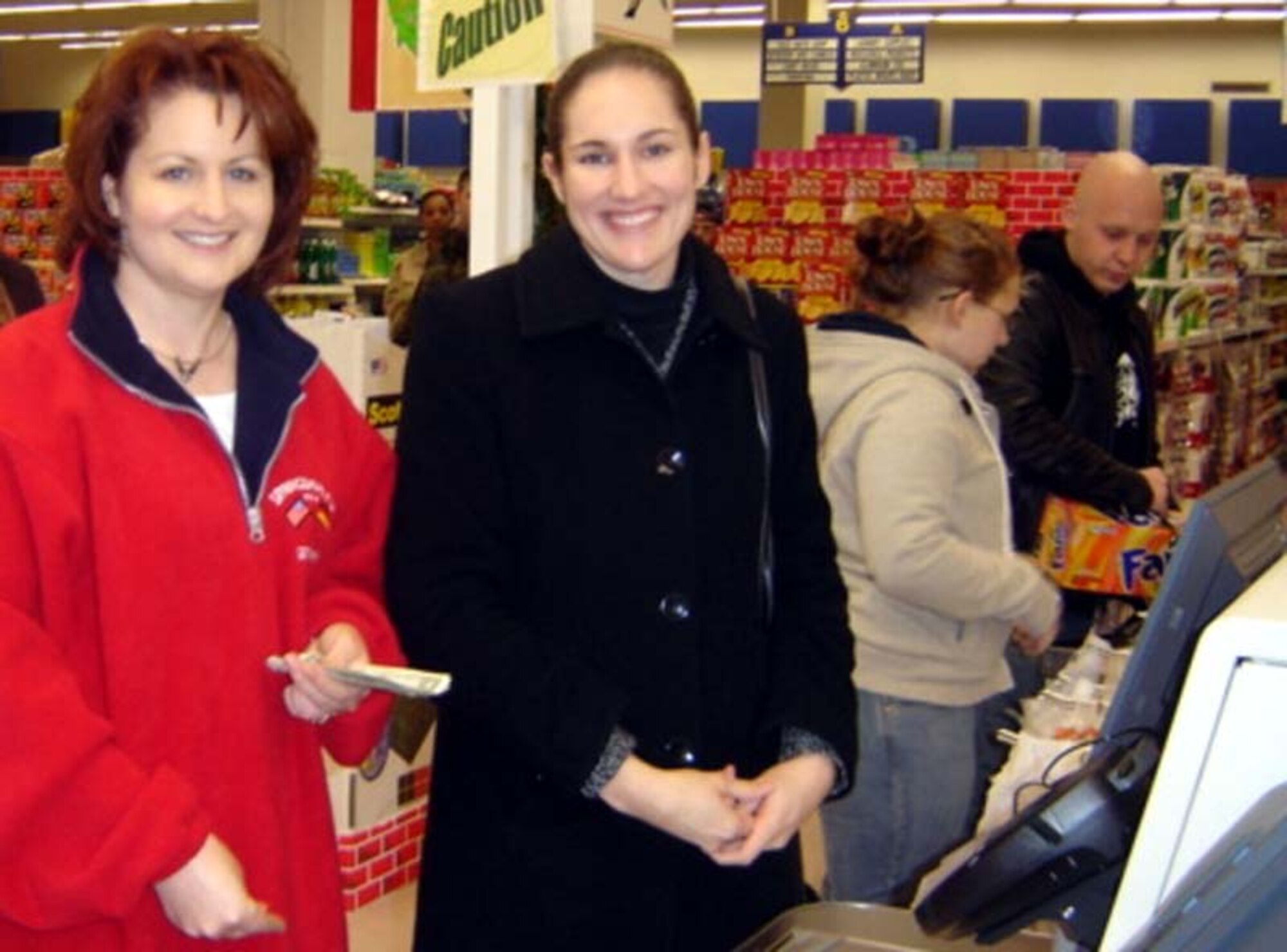 SPANGDAHLEM AIR BASE, Germany -- Members of the Spangdahlem Spouses and Enlisted Members Club performed random acts of kindness at the Spangdahlem and Bitburg commissaries, when they purchased more than $5,000 worth of groceries for more than 100 E-5s and below and their families Dec. 15 - 17, 2007. (Courtesy photo) 