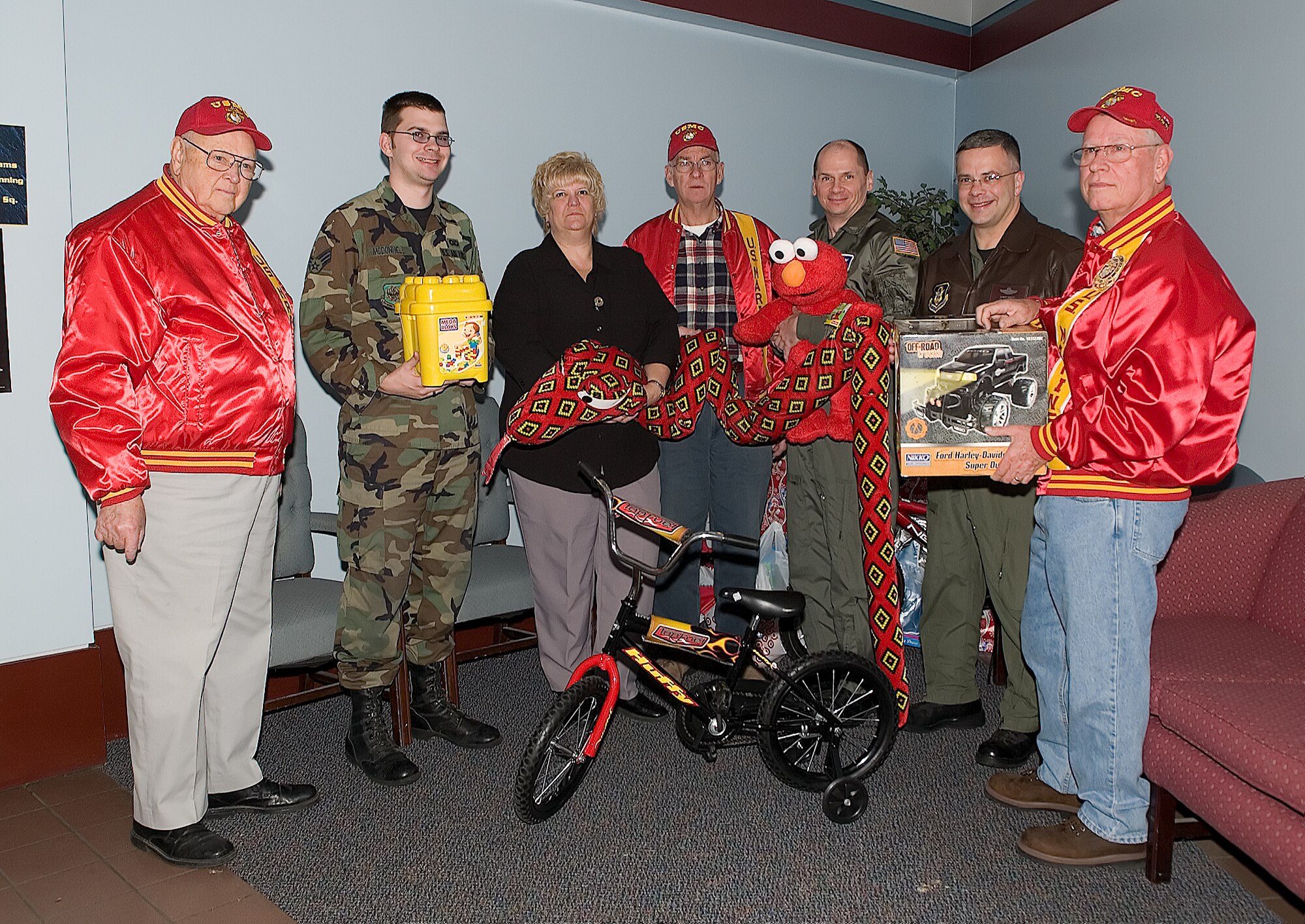 Jim Thompson, Marine Reserve representative for Kent County, Senior Airman Matthew McDonnell, 436th Airlift Wing command post senior operations controller, Leanne Pravitz, 436th AW command post, Ralph Willis, Marine Reserve representative for Kent County, Col. Eric Wydra, 436th AW vice commander, Col. Randal Bright, 512th AW commander, and George Weiss, Marine Reserve representative for Kent County, visited the Dover AFB command post and collected toy donations for the Marine Reserve's Toys for Tots drive Dec. 13. The Dover Air Force Base donations are among the more than 5,000 toys collected in Delaware this year. (U.S. Air Force photo/Jason Minto)