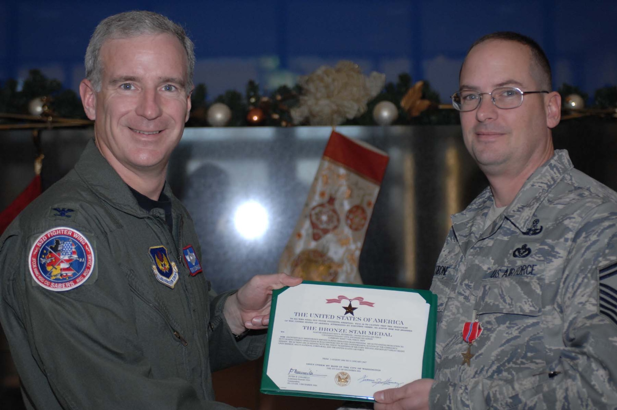 SPANGDAHLEM AIR BASE, Germany -- Senior Master Sgt. Ken Pettibone, 52nd Civil Engineer Squadron, is presented with his Bronze Star certificate by Col. Thomas Feldhausen, 52nd Fighter Wing vice commander. This is Sergeant Pettibone’s second Bronze Star. (U.S. Air Force photo/Airman 1st Class Jenifer Calhoun)