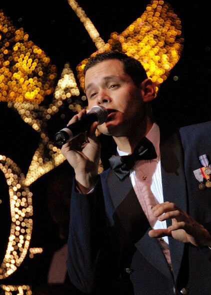 OSAN AIR BASE, Republic of Korea -- U. S. Air Force Tops in Blue vocalist, Staff Sgt. Daniel Rutherford, performs for Team Osan members during Tops in Blue's annual world tour celebrating "The Fly-By", a musical tribute to 60 years of proud Air Force history.  (U. S. Air Force photo by Senior Master Sgt. Marvin Krause)