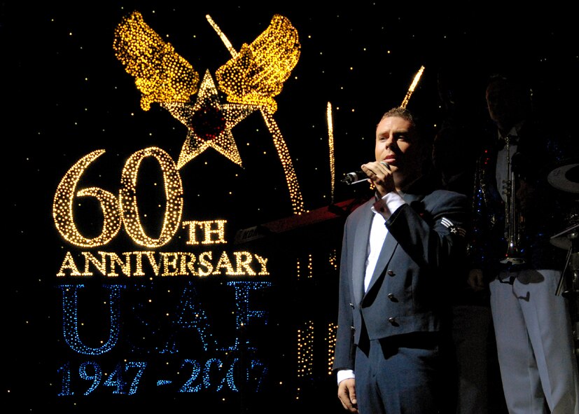 OSAN AIR BASE, Republic of Korea -- U. S. Air Force Tops in Blue vocalist, Senior Airman Nicholas Amari, performs for Team Osan members during Tops in Blue's annual world tour celebrating "The Fly-By", a musical tribute to 60 years of proud Air Force history.  (U. S. Air Force photo by Senior Master Sgt. Marvin Krause)