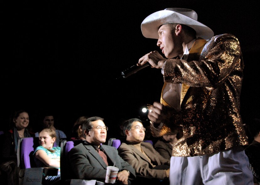 OSAN AIR BASE, Republic of Korea -- U. S. Air Force Tops in Blue vocalist, Senior Airman Johnathan Hayden, performs for Team Osan members during Tops in Blue's annual world tour celebrating "The Fly-By", a musical tribute to 60 years of proud Air Force history.  (U. S. Air Force photo by Senior Master Sgt. Marvin Krause)