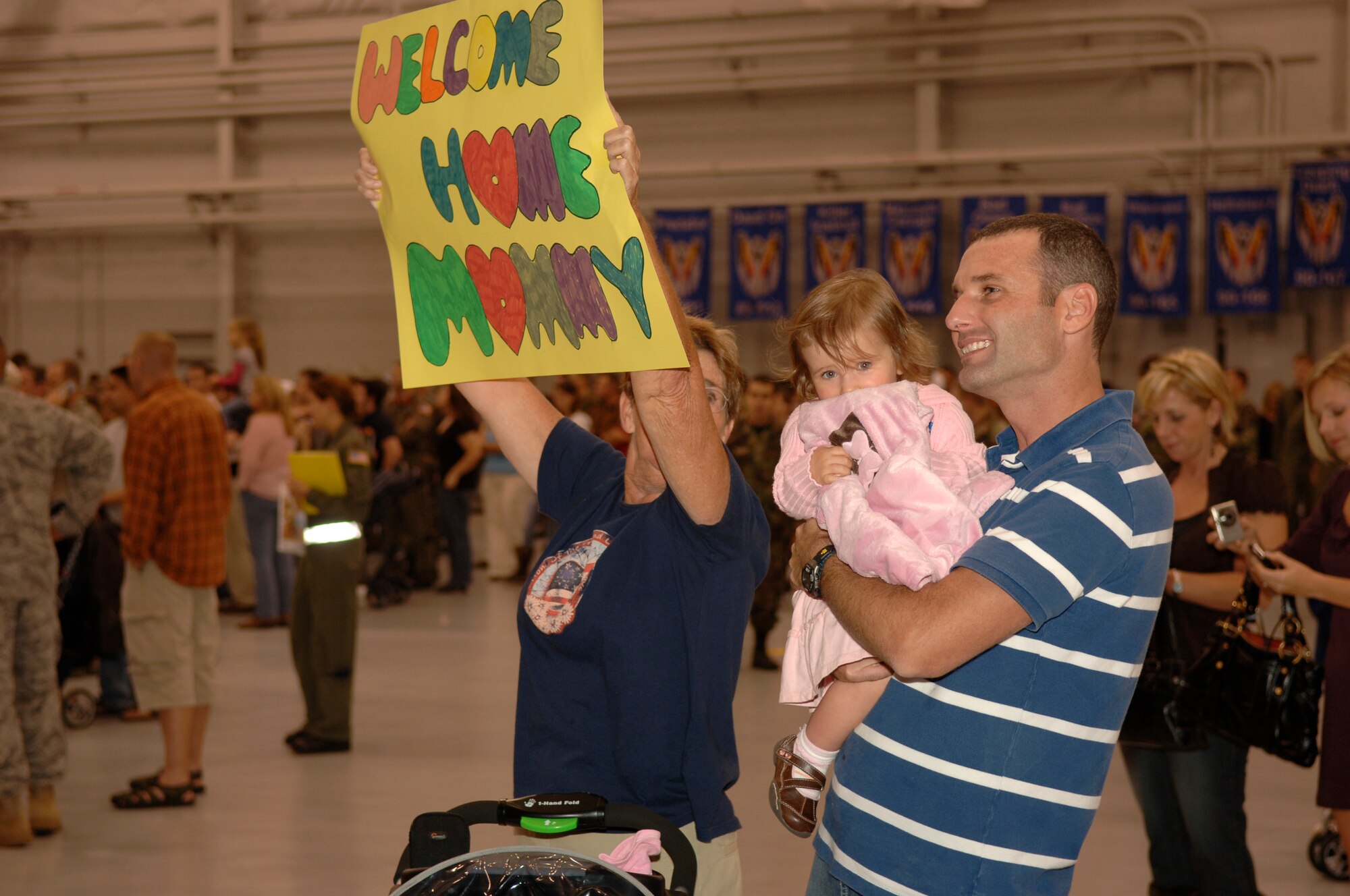 Family, friends and co-workers welcome back Hurlburt Field Airmen returning home Dec. 7 during Operation Homecoming. Operation Homecoming is a ceremony dedicated to supporting the men and women returning from deployment overseas. (U.S. Air Force photo/Airman 1st Class Matthew Loken)