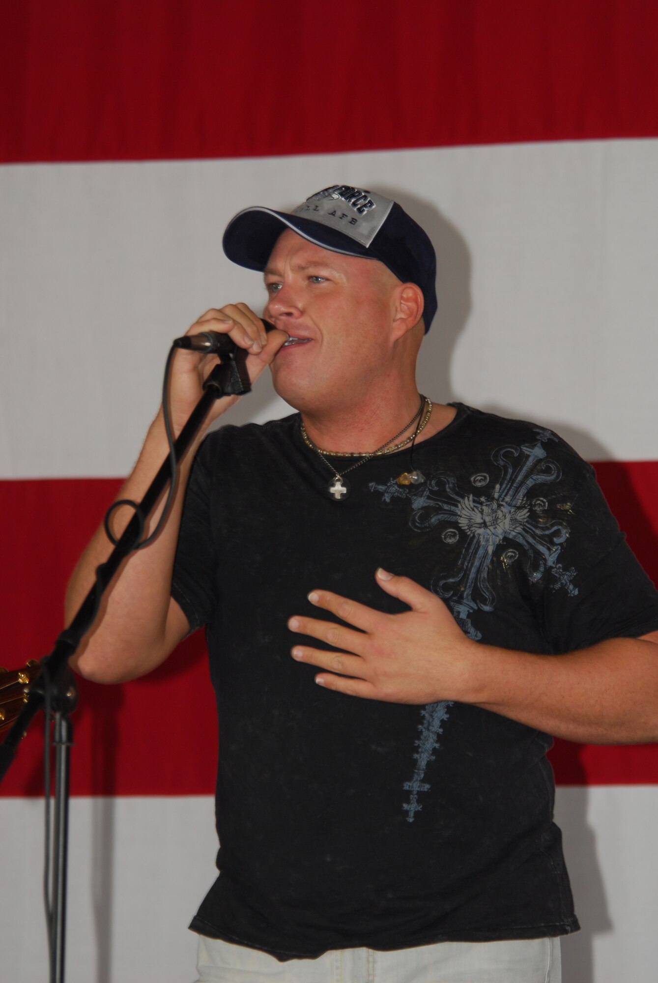 Daniel Smith, upcoming country star, visited Tyndall Air Force Base Dec. 14 to perform some of his songs during a commander's call at Hangar 1.  Smith is the singer of "Thank You," a song dedicated to the men and women of the United States military, and the hit single "What you see is what you get."  He also performed a couple of his songs at the Collocated Club Friday night.  (Photo by Lisa Norman)