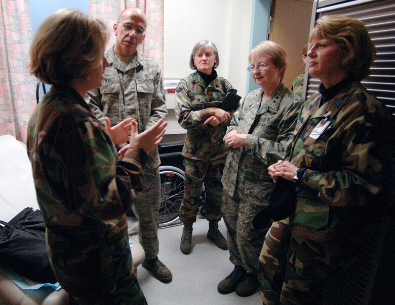While visiting staff and patients at Landstuhl Regional Medical Center, Germany, Dec. 12 Maj. Gen. Melissa A. Rank, Assistant Air Force Surgeon General, Medical Force Development and Nursing Services, discusses the comparative technical abilities of Air Force and Army medical technicians with family nurse practitioner Capt. Kathleen McKinney. (U.S. Air Force photo/Master Sgt. Scott Wagers)