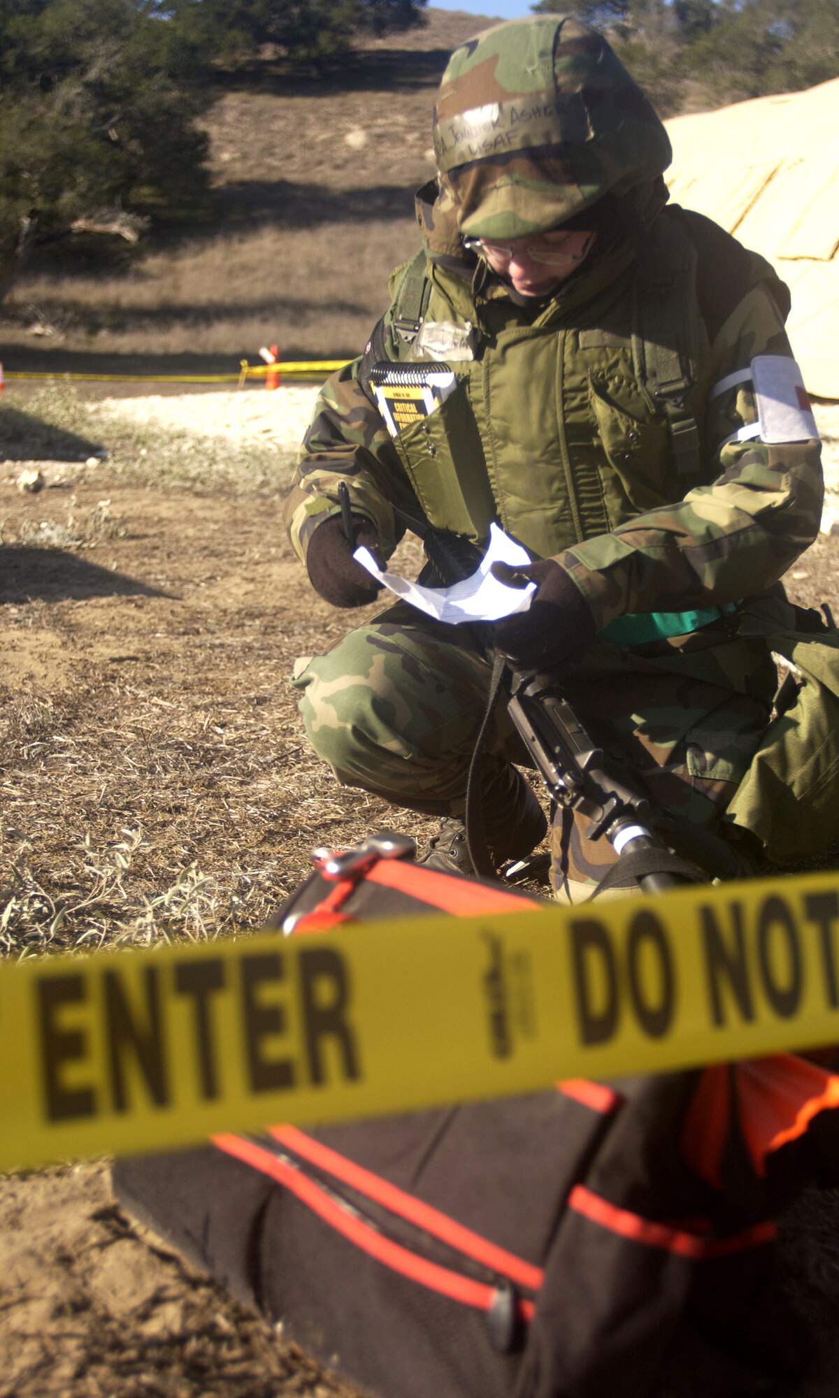 VANDENBERG AIR FORCE BASE, Calif. -- Senior Airman Jennifer Asher of the 30th Medical Group reviews notes to prepare for a mock attack during North Star on Dec. 13. North Star trains Airmen for real world deployed situations. (U.S. Air Force photo / Airman 1st Class Christopher Hubenthal)             