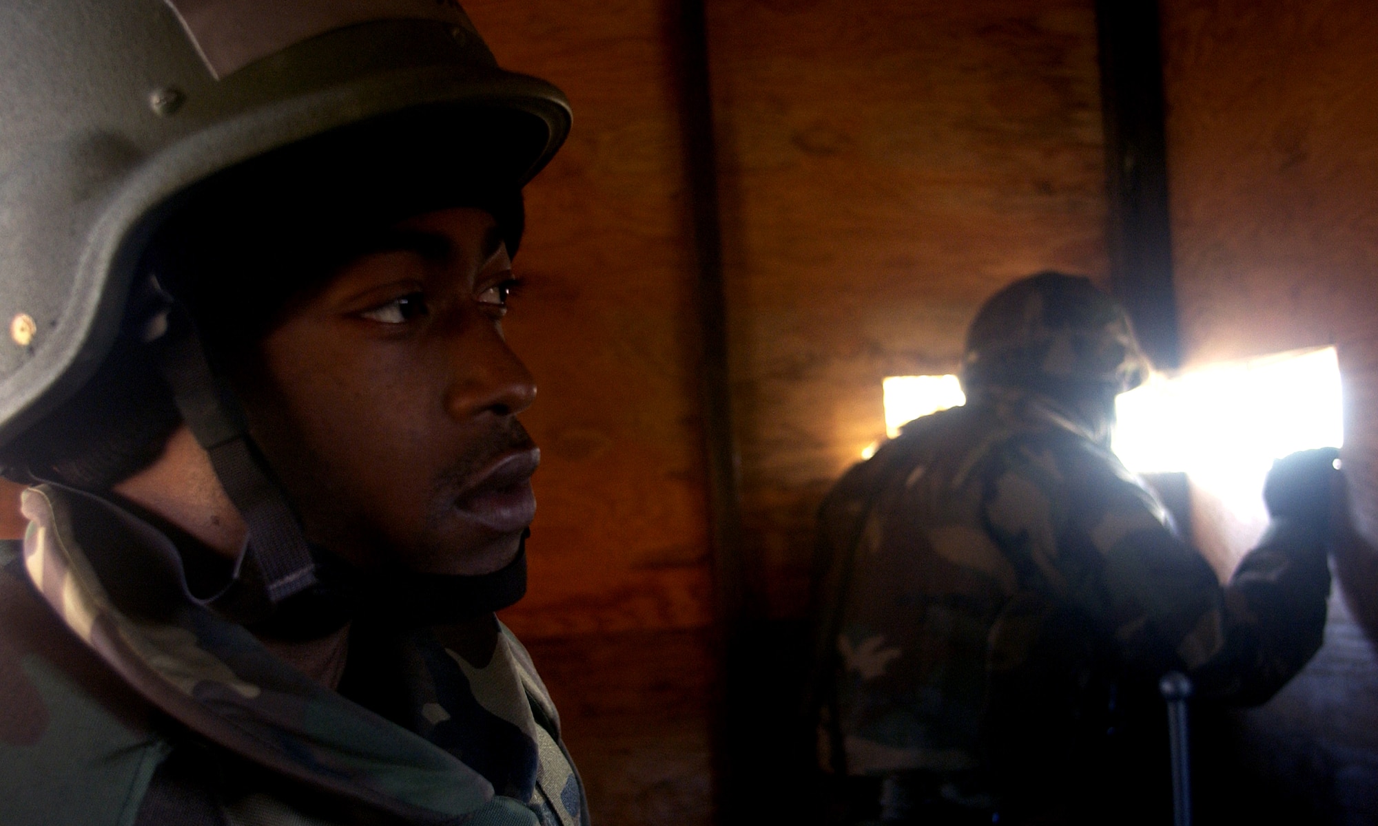 VANDENBERG AIR FORCE BASE, Calif. -- Staff Sgts. Jaylynd Brown and Dan Merrill (right), of the 30th Logistics Readiness Squadron, scan the area from a bunker during North Star on Dec. 13. North Star trains Airmen for real world deployed situations. (U.S. Air Force photo / Airman 1st Class Christopher Hubenthal)