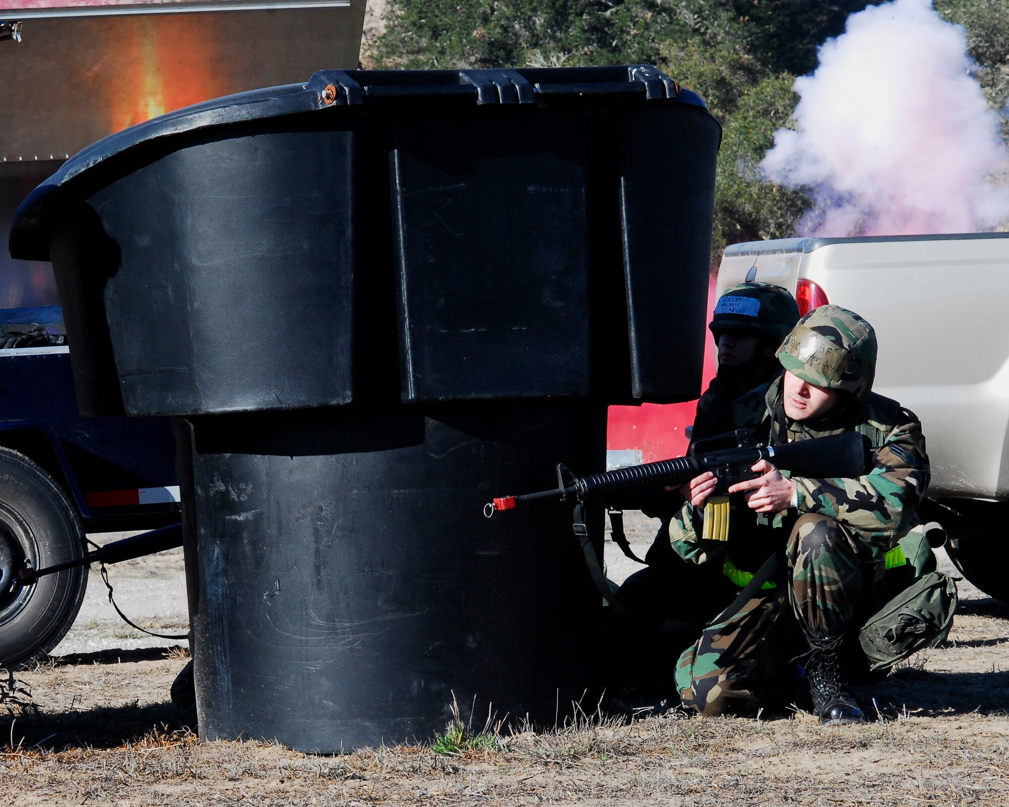 VANDENBERG AIR FORCE BASE, Calif. -- An Airman of the 30th Space Wing takes cover and scans his sectors of fire during the North Star exercise on Dec. 13. The exercise prepares and trains Airmen for a possible deployed environment. (U.S. Air Force photo / Airman 1st Class Ashley Reed)                         
