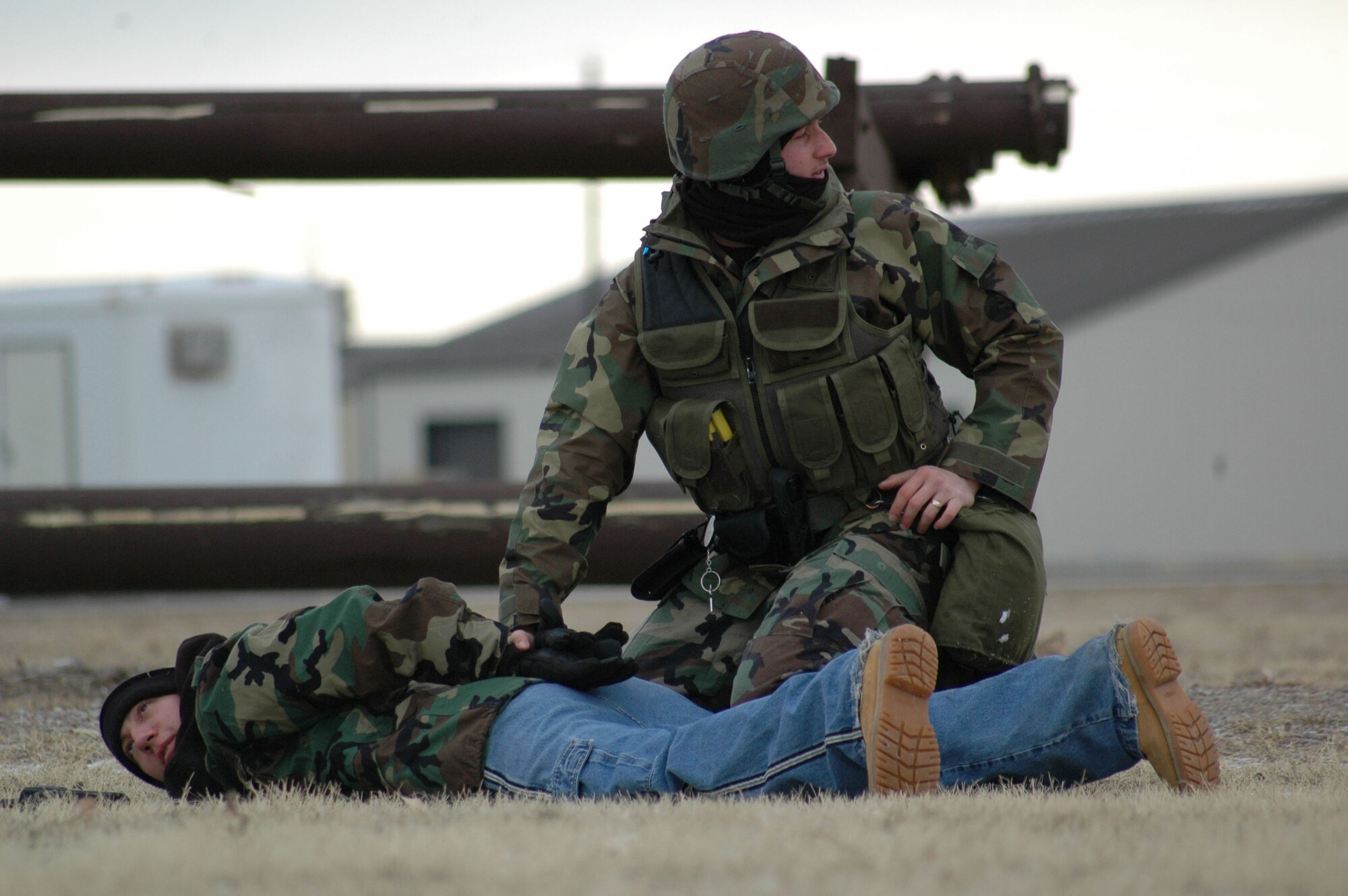 Airman David Dicenso, 341st Missile Security Forces Squadron member, apprehends Airman 1st Class Robert Kennedy, 341st MSFS member and role-player, during an expeditionary readiness exercise at Camp Grizzly Dec. 12. (U.S. Air Force photo/Airman 1st Class Dillon White)