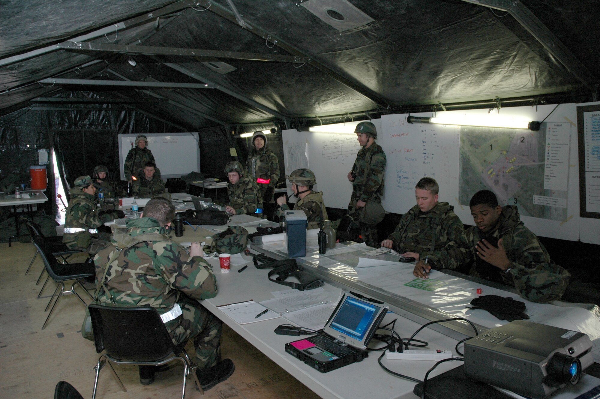 Airmen man a wing operations center at Camp Grizzly during an expeditionary readiness exercise Dec. 13. (U.S. Air Force photo/Airman 1st Class Dillon White)