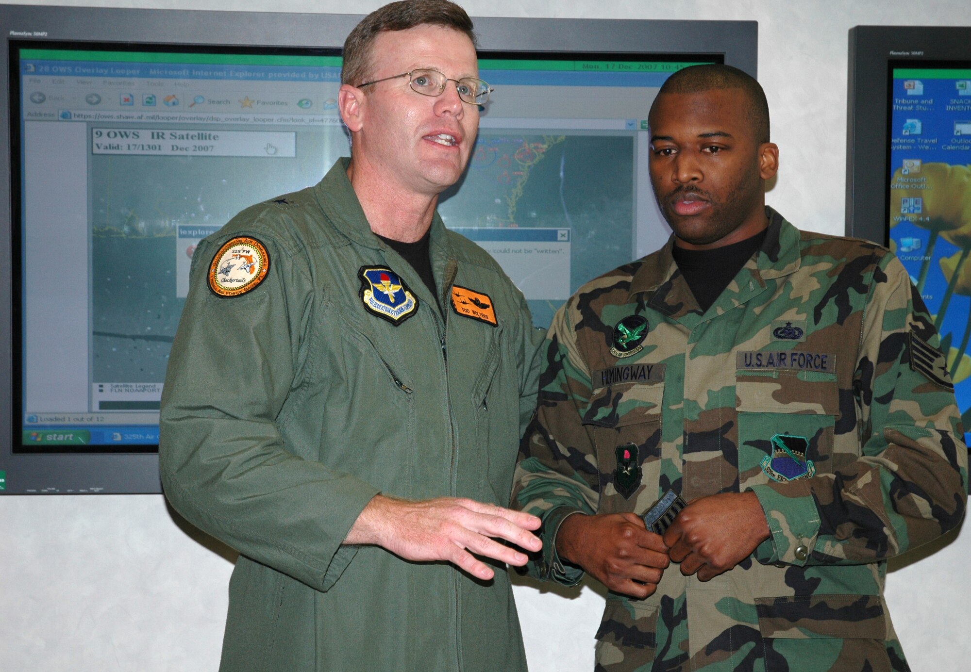 Brig. Gen. Tod Wolters, 325th Fighter Wing commander, adresses the 325th Air Control Squadron upon presenting Staff Sgt. Antenney Hemingway, 325th ACS NCO in charge of supply with two technical sergeant chevrons for his promtion under the Stripes for Exceptional Performers program.  General Wolters STEP promoted three individuals on Dec. 17 along with Chief Master Sgt. Benjamin Van Vleet, 325th Fighter Wing command chief master sergeant.  (U.S. Air Force photo/Staff Sgt. Timothy R. Capling)
