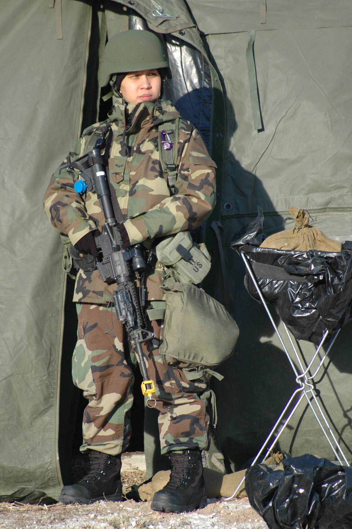 Airman 1st Class Jennifer Comacho, 341st Missile Security Forces Squadron member, guards a tent entrance during an expeditionary readiness exercise at Camp Grizzly Dec. 12. (U.S. Air Force photo/Dillon White)