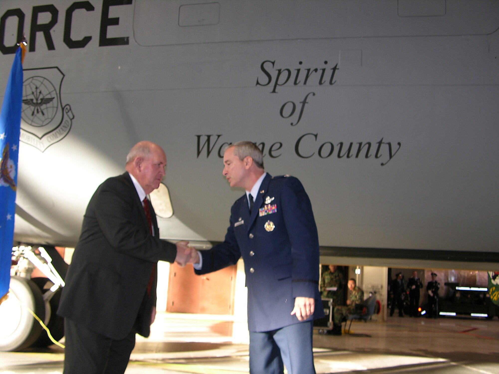 SEYMOUR JOHNSON AIR FORCE BASE, N.C.--Wayne County Commissioner Bud Gray and Col. Fritz Linsenmeyer, commander of the 916th Air Refueling Wing, shake hands following a plane-naming ceremony here, Dec. 17. The plane, formerly # 62-3509, was rededicated during the ceremony as "The Spirit of Wayne County."