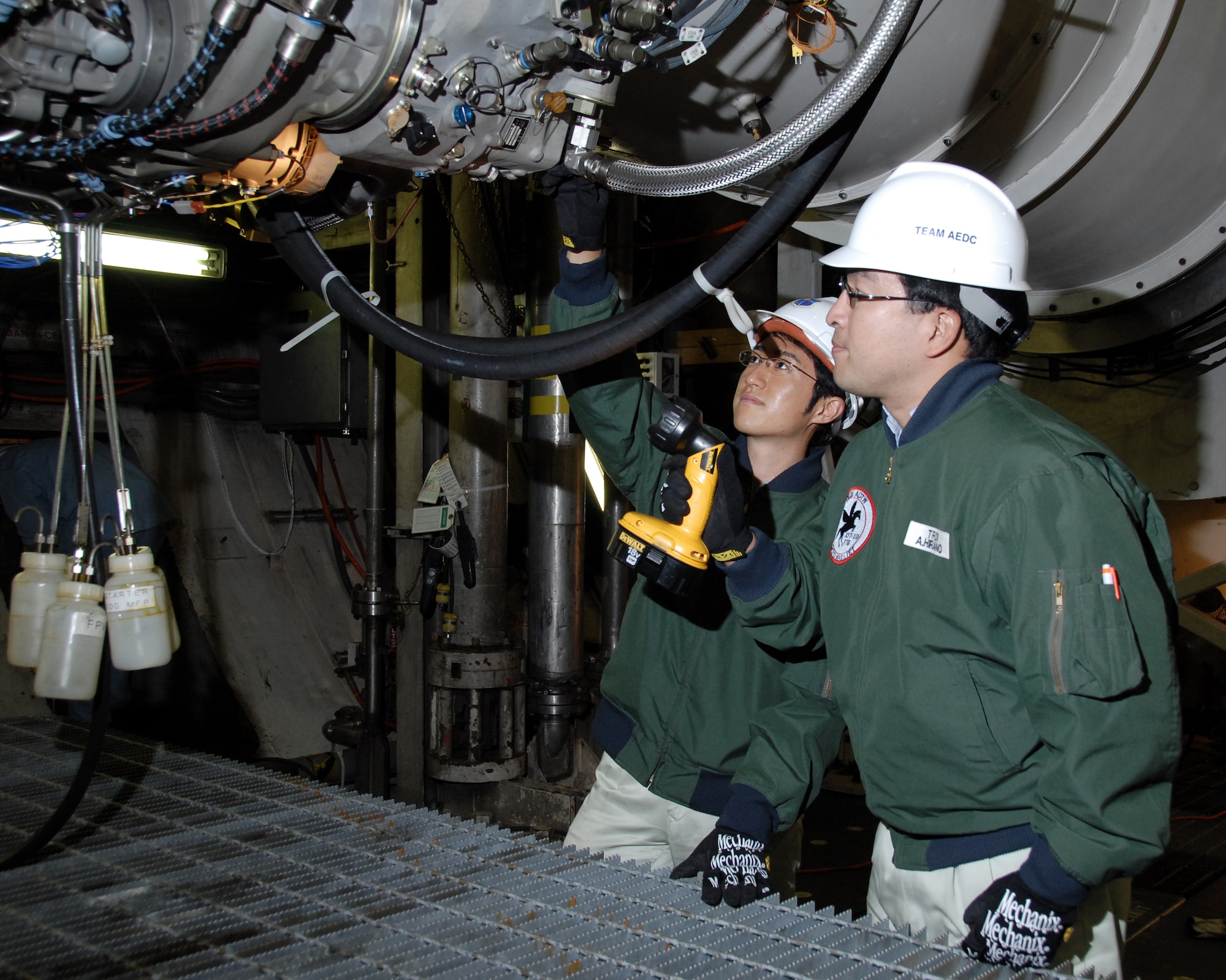 From left: Yoshiki Miyairi and Atsushi Hirano researchers in Japan’s Technical Research and Development Institute (TRDI) within the Ministry of Defense (MOD), inspected the XP-1 engine during a break in the testing at Arnold’s C-2 test cell. (Photo by Rick Goodfriend)