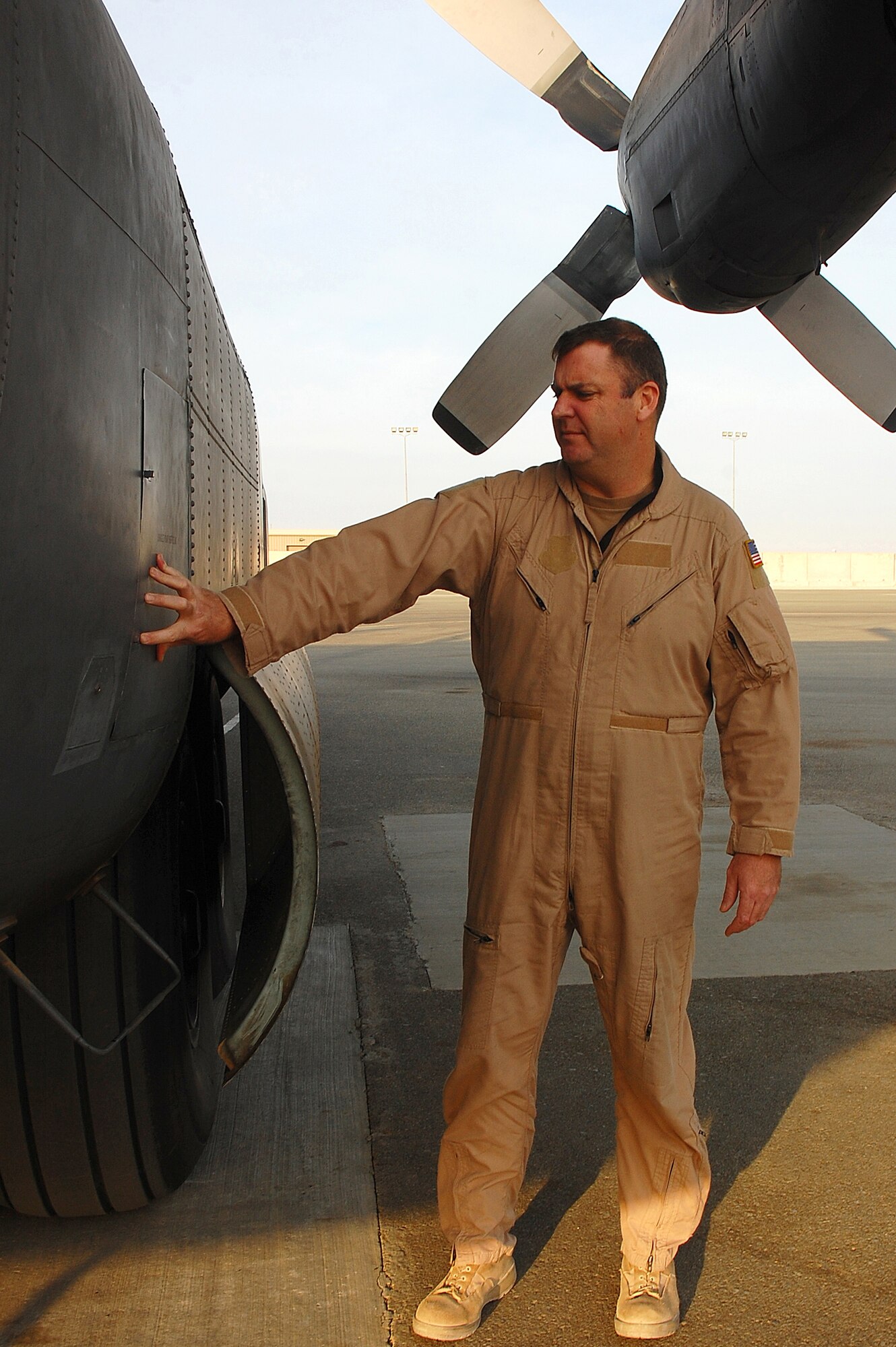 SOUTHWEST ASIA -- Master Sgt. Anthony Roy conducts a preflight inspection on an EC-130H Compass Call aircraft Dec. 8 here.  Sergeant Roy is an instructor flight engineer with the 43rd Expeditionary Electronic Combat Squadron and is deployed from Davis-Monthan AFB., Ariz.  (U.S. Air Force photo/Staff Sgt. Tia Schroeder)