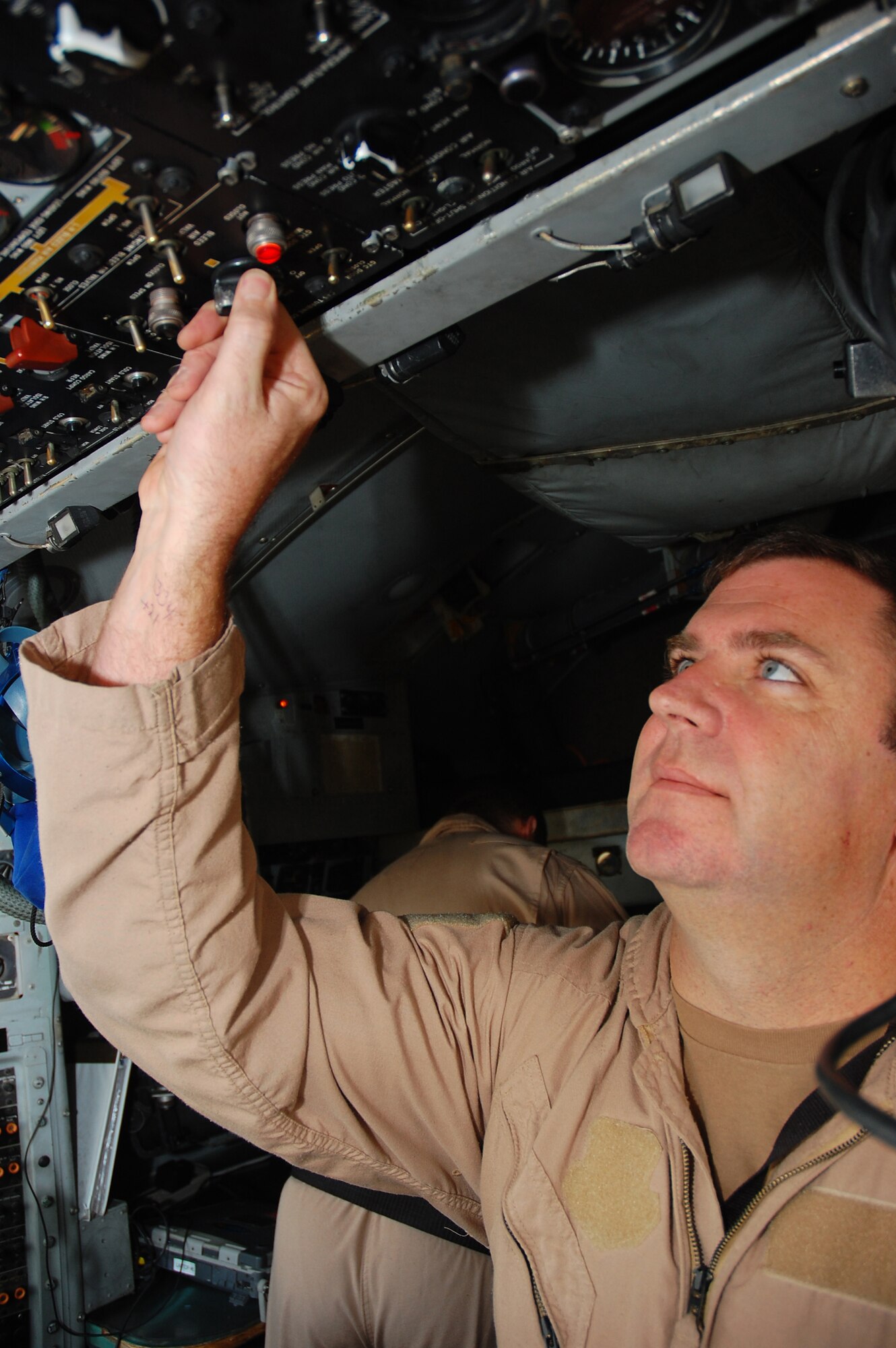 SOUTHWEST ASIA -- Master Sgt. Anthony Roy conducts a preflight inspection on an EC-130H Compass Call aircraft Dec. 8 here.  Sergeant Roy is an instructor flight engineer with the 43rd Expeditionary Electronic Combat Squadron and is deployed from Davis-Monthan AFB., Ariz.  (U.S. Air Force photo/Staff Sgt. Tia Schroeder)