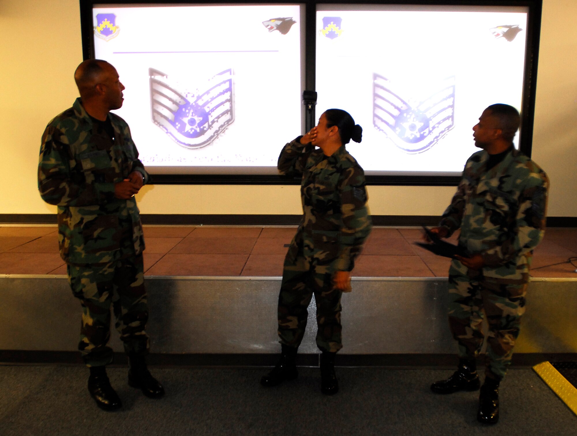 KUNSAN AIR BASE, South Korea -- Staff Sgt. Gracey Martinez, Airfield Management Non-Commissioned Officer In-Charge, is STEP promoted to Technical Sergeant here Dec 20.  Sgt. Martinez is presented her new rank by Colonel CQ “Wolf” Brown, 8th Fighter Wing Commander, and Chief Master Sgt. Anthony “Wolf Chief” Brinkley, 8th Fighter Wing Command Chief, during wing stand-up.  (U.S. Air Force photo/ Tech. Sgt. Quinton T. Burris)