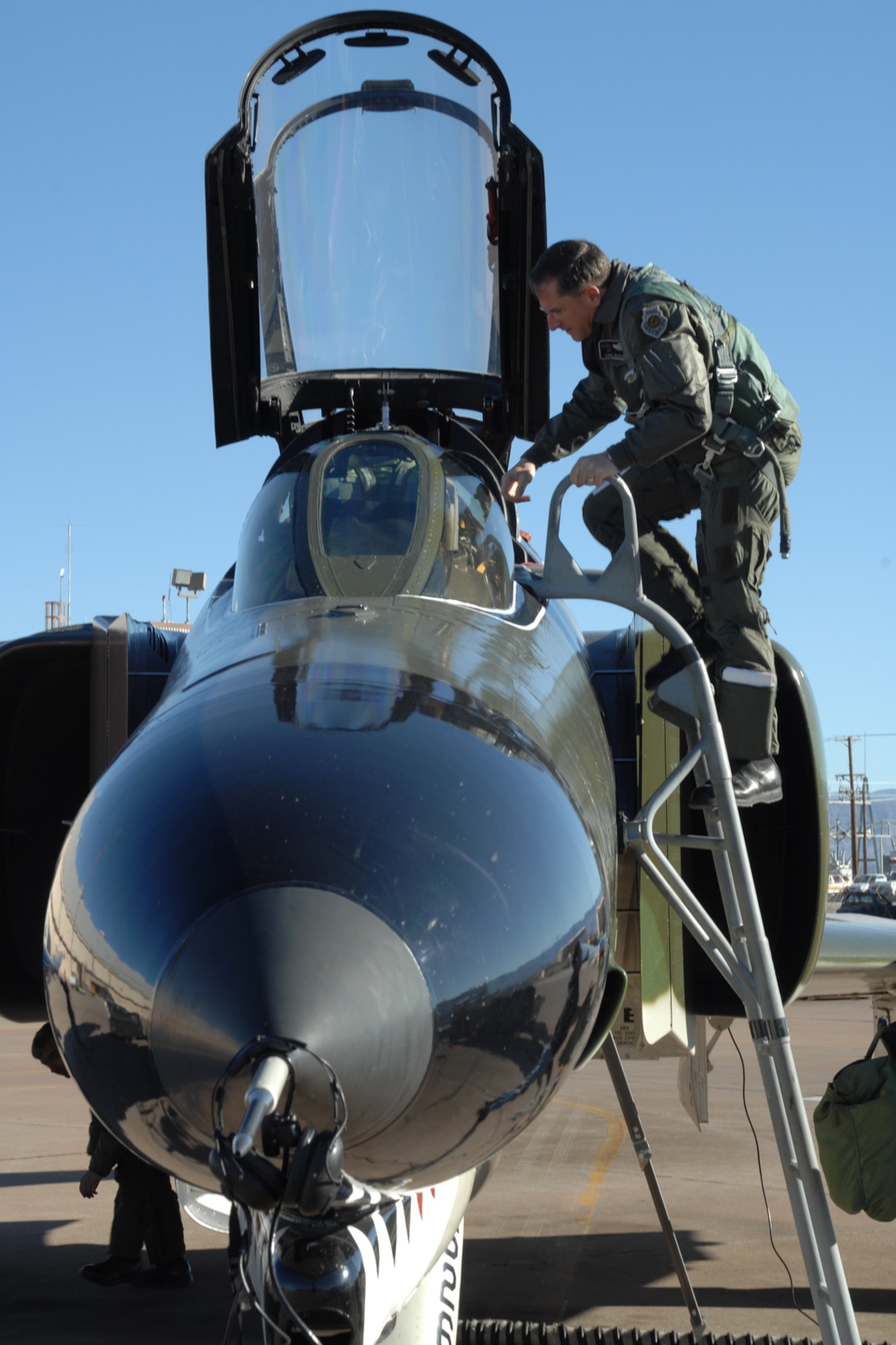 Brig. Gen. David Goldfein, 49th Fighter Wing commander, boards a F-4 Phantom Dec. 20, 2007, at Holloman Air Force Base, N.M. This was Brig. Gen. Goldfein's first time flying the F-4 and it served as a special occassion for him since his father, Bill Goldfein, flew the Phantom in Vietnam. (U.S. Air Force photo/Airman 1st Class Jamal D. Sutter)